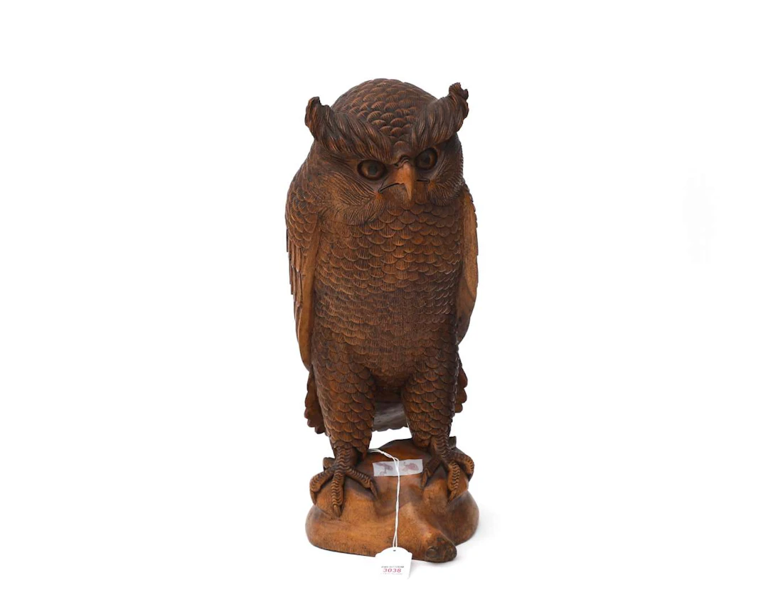 A carved wooden sculpture of an eagle owl, Europe, 20th century