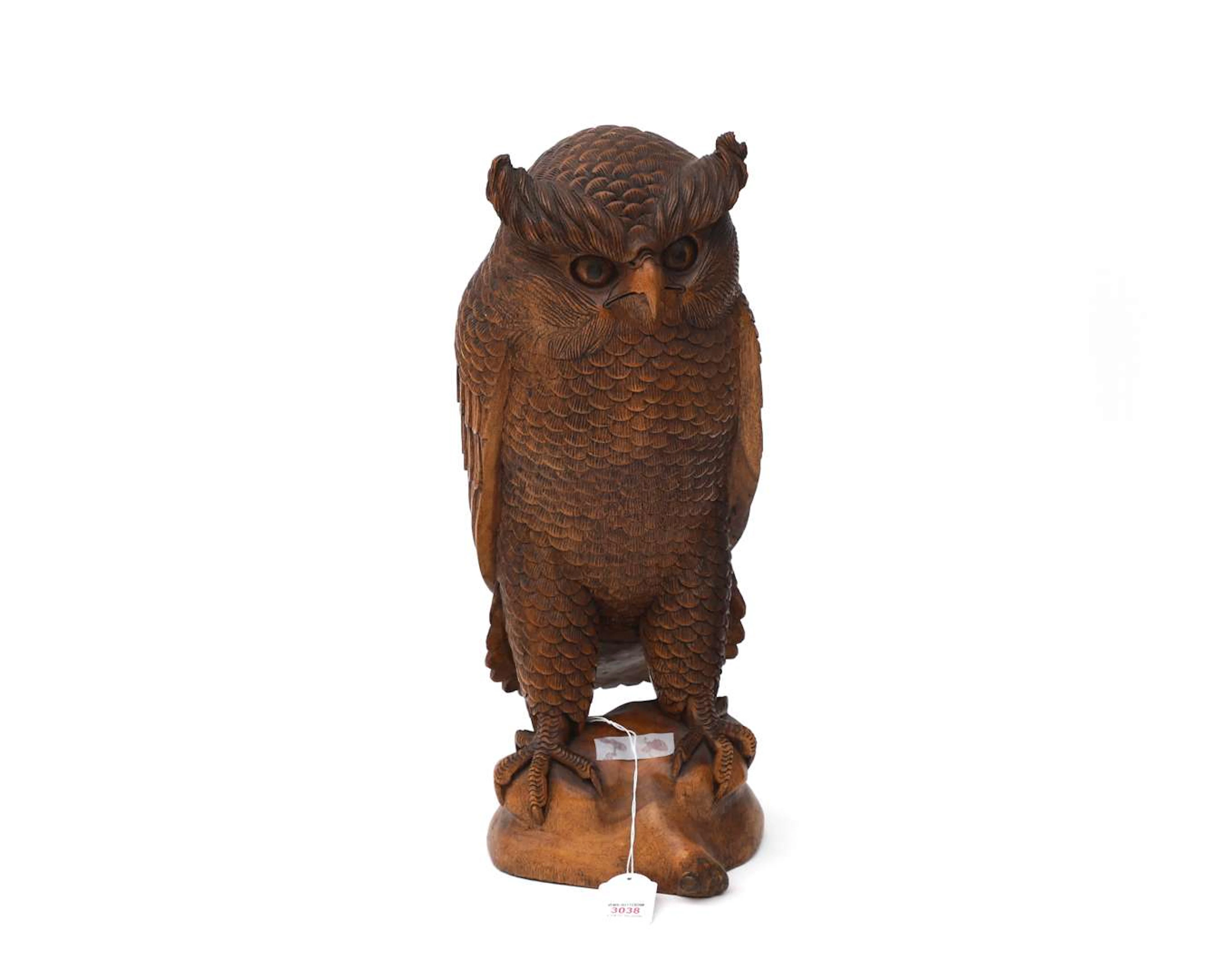 A carved wooden sculpture of an eagle owl, Europe, 20th century