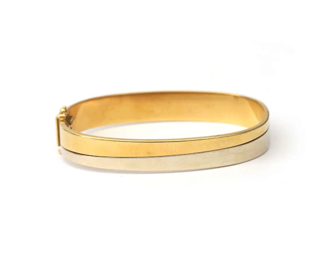 An 18k two-tone gold bangle bracelet, 20th century
