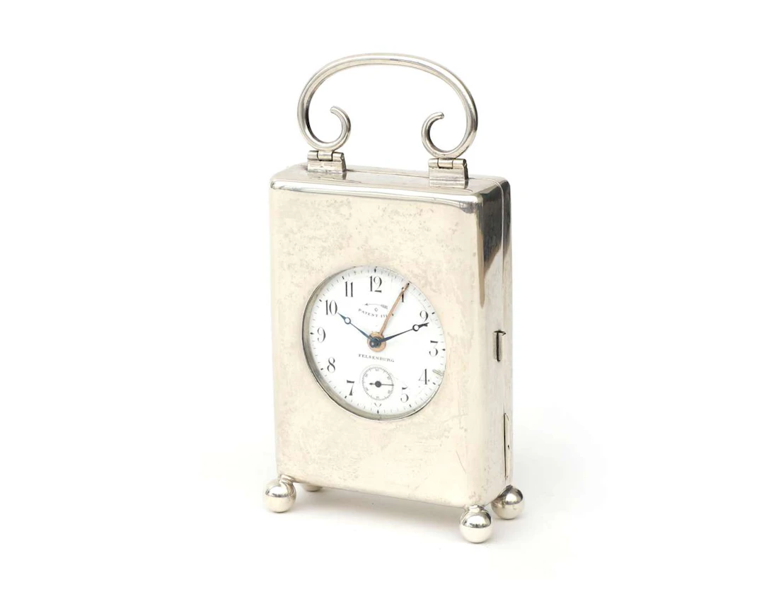 A silver watch case with a pocket watch, Germany, Dresden, 20th century