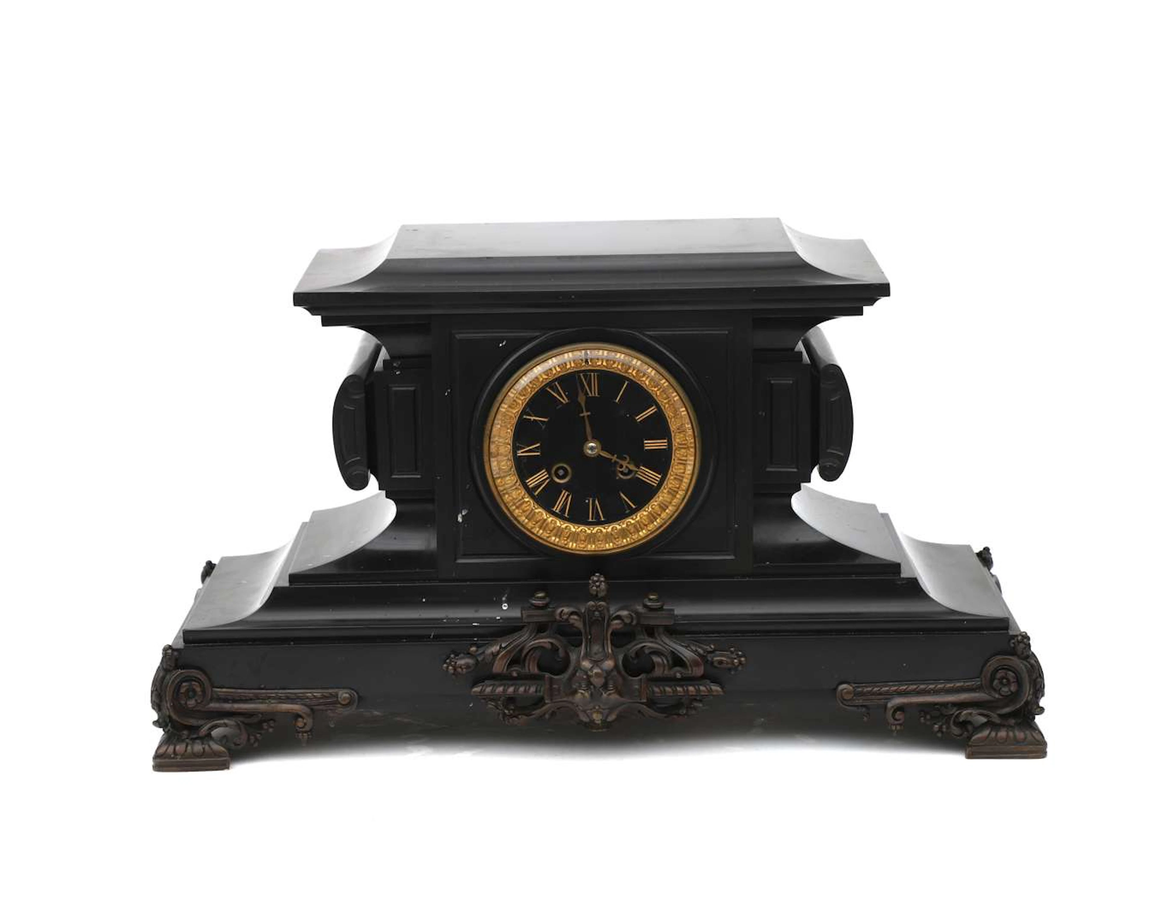 A black natural stone mantelpiece clock, France, late 19th century