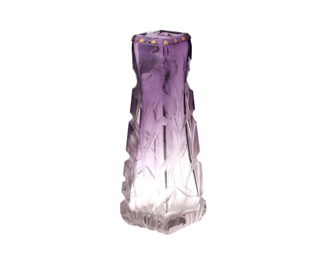 A square white and purple glass vase with cut floral decoration. Art