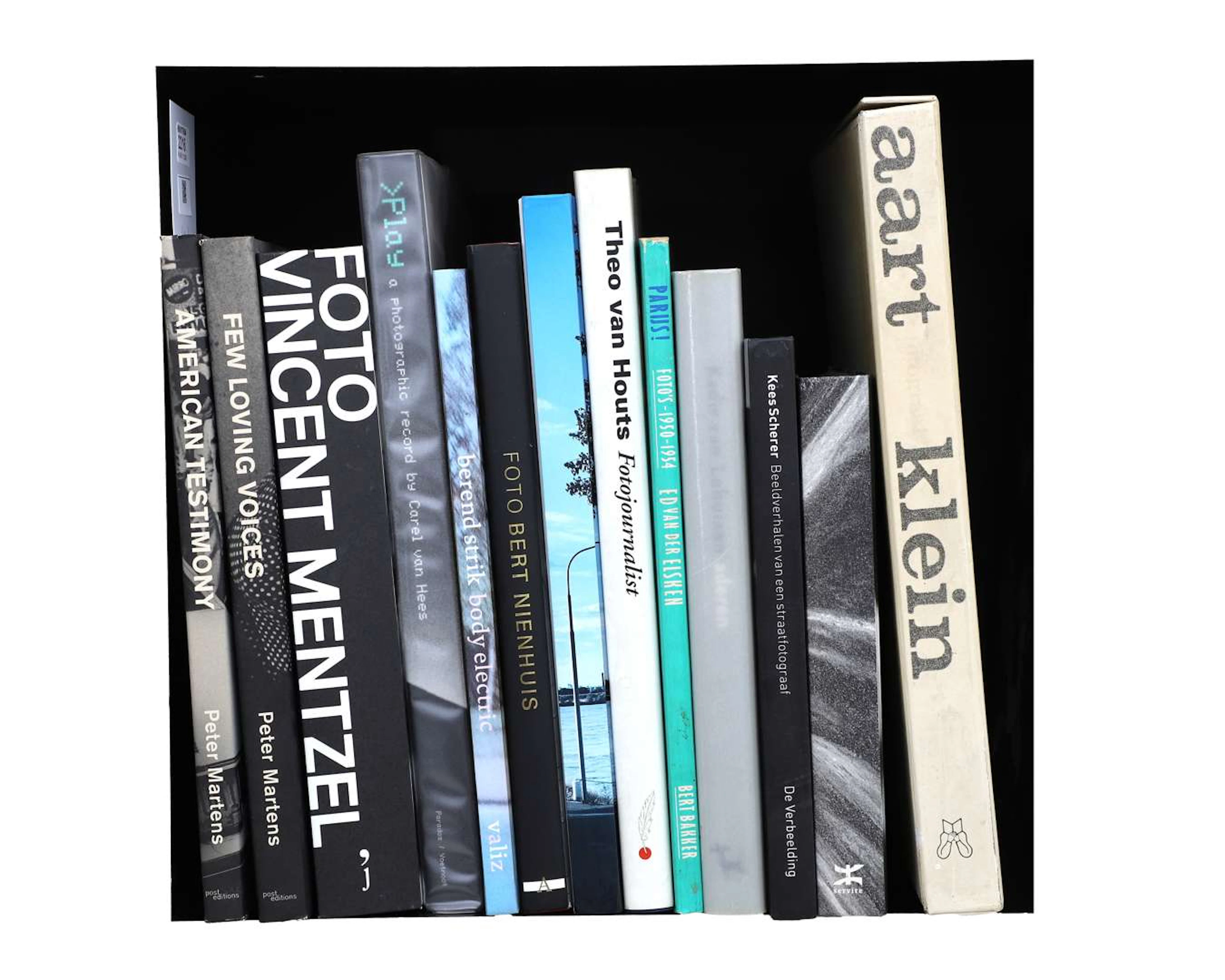 A collection of 13 photography books, mostly monographs by or about