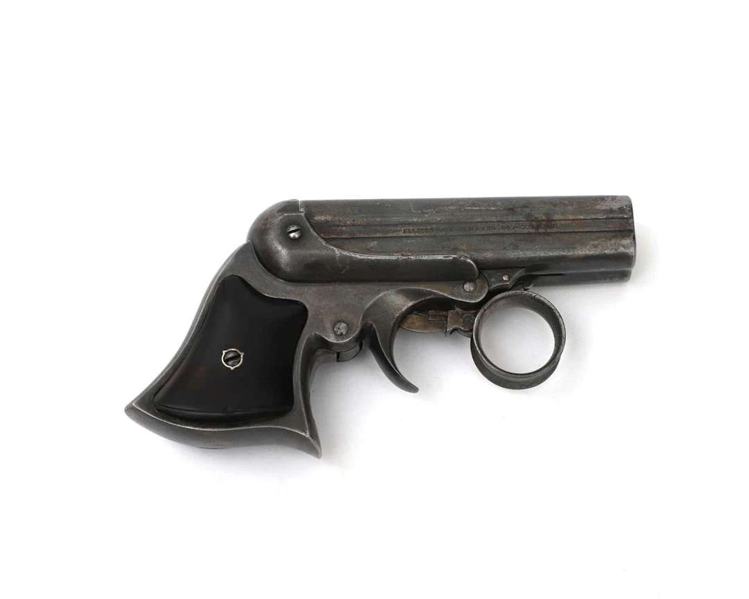A ring-trigger derringer pistol, manufactured by: Remington Elliot