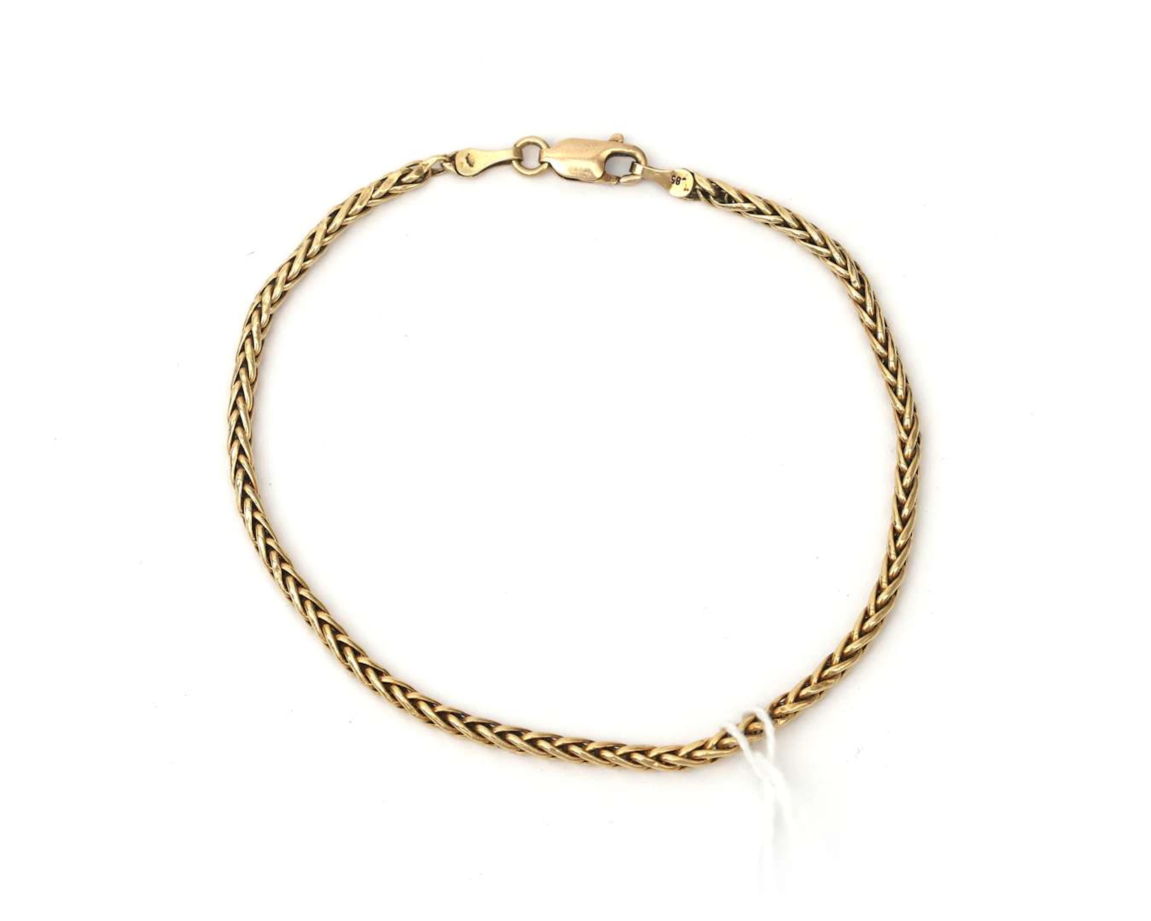 A 14k yellow gold foxtail link bracelet
