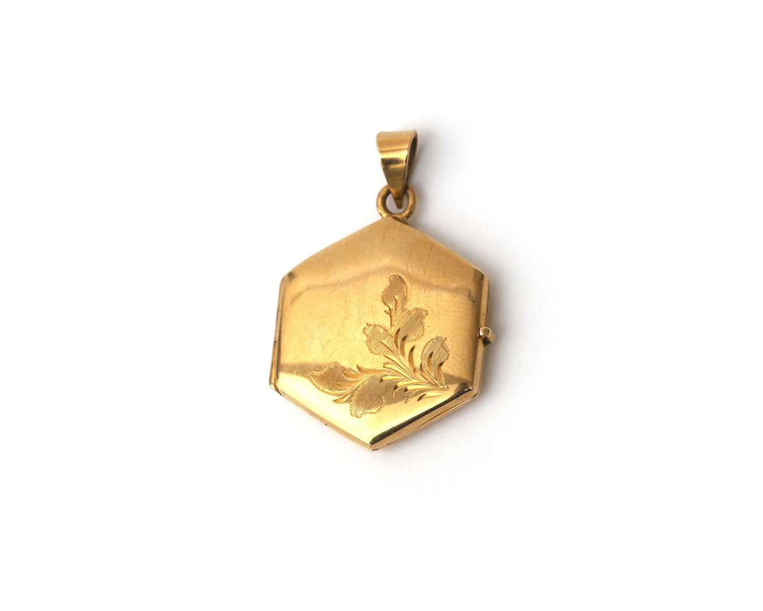 A 14k yellow gold medallion pendant