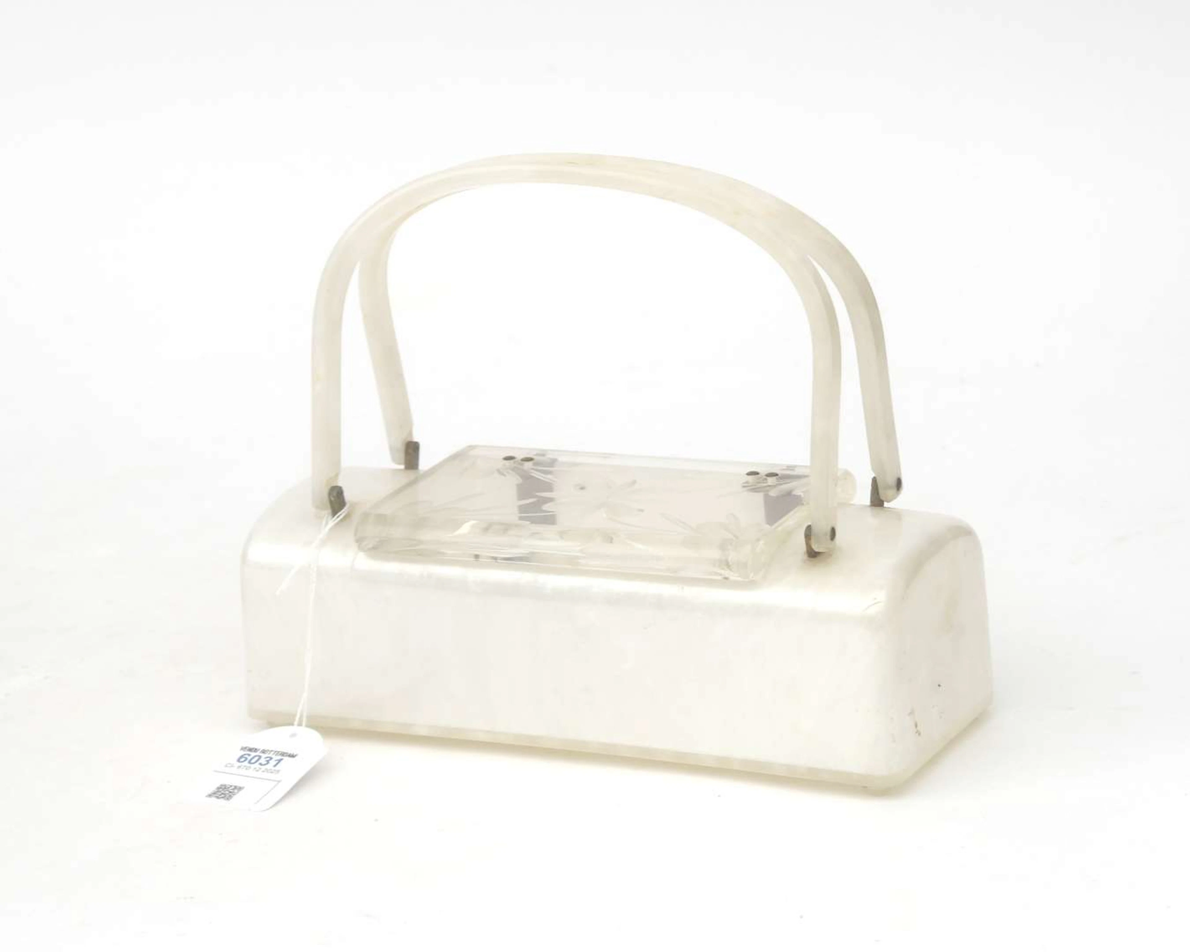 A mother-of-pearl lucite handbag/clutch, 1950s