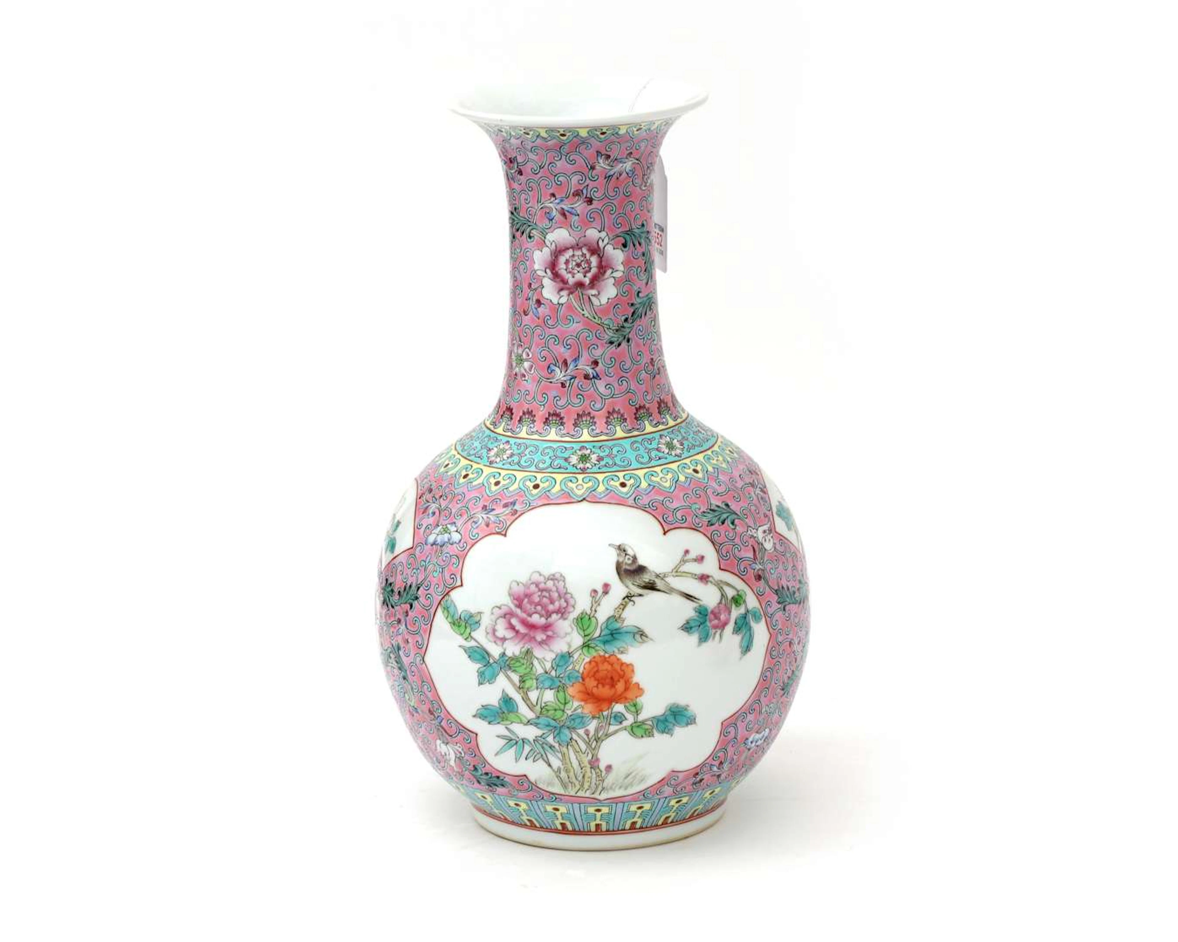 A coloured porcelain vase. Famille rose, with birds and flowers in