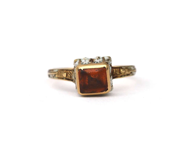 A yellow-gold Renaissance Revival ring set with citrine and enamel