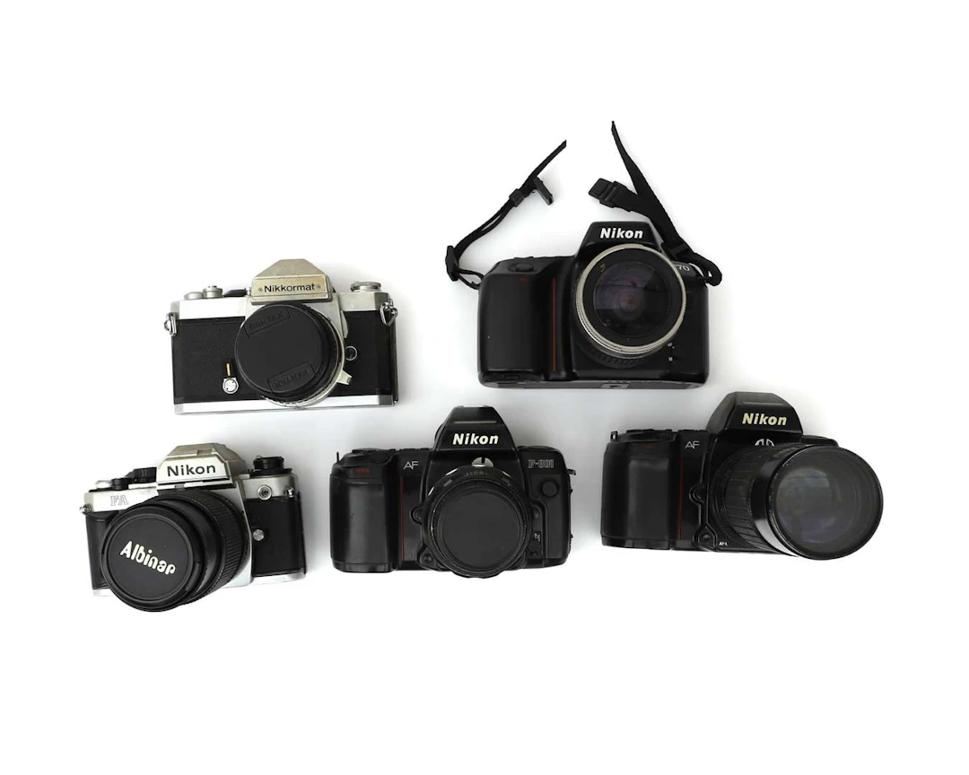 Five Nikon 35mm cameras