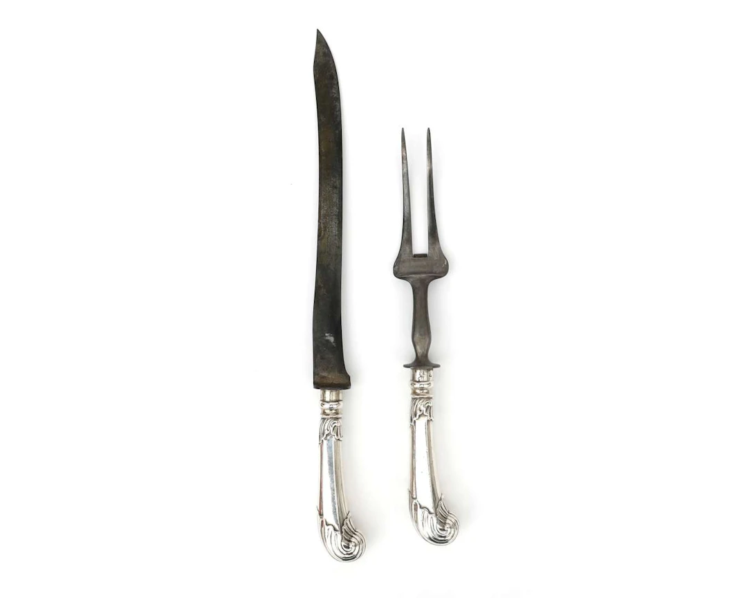 A silver carving set with a pistol-shaped handle, Holland, Rotterdam