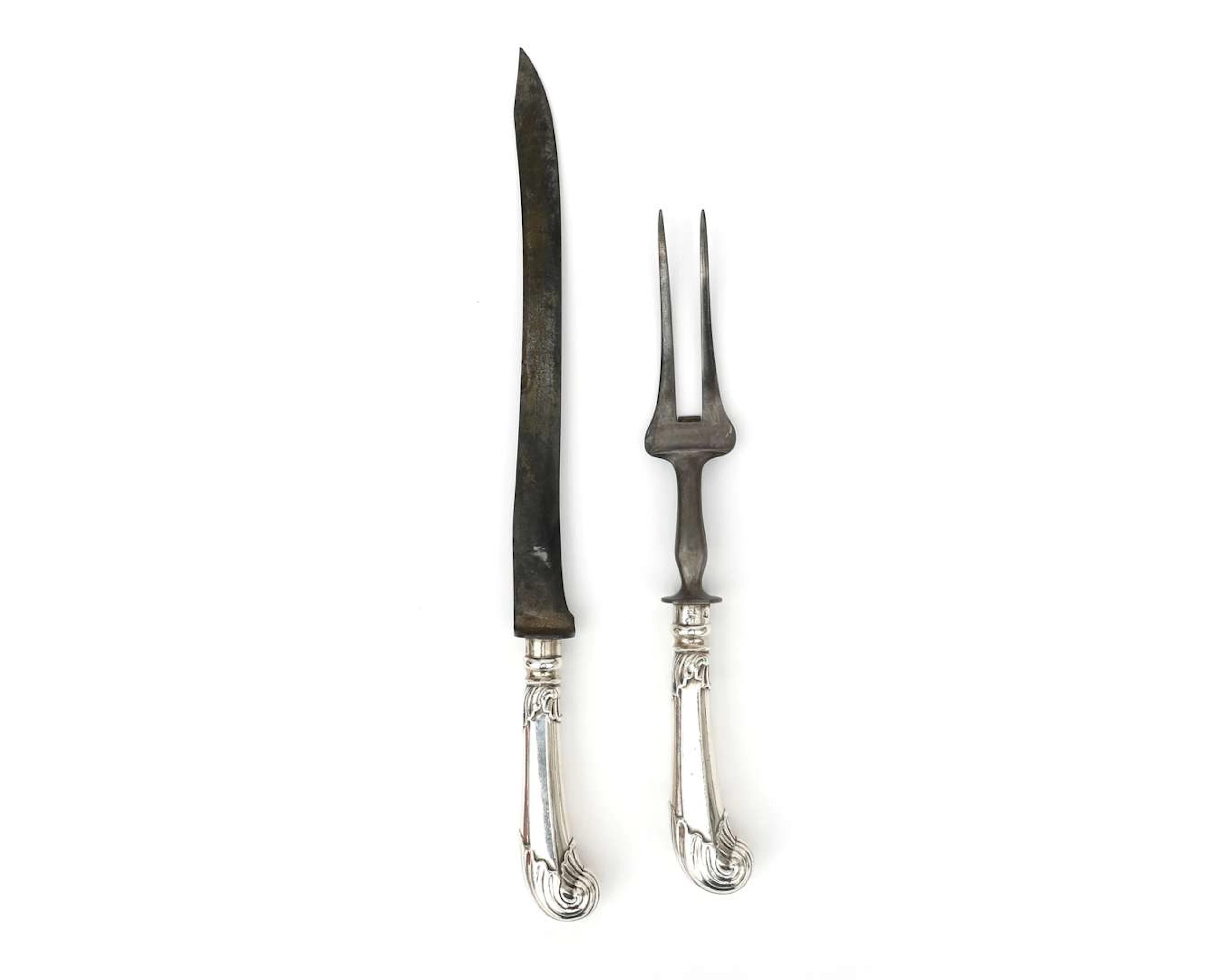 A silver carving set with a pistol-shaped handle, Holland, Rotterdam