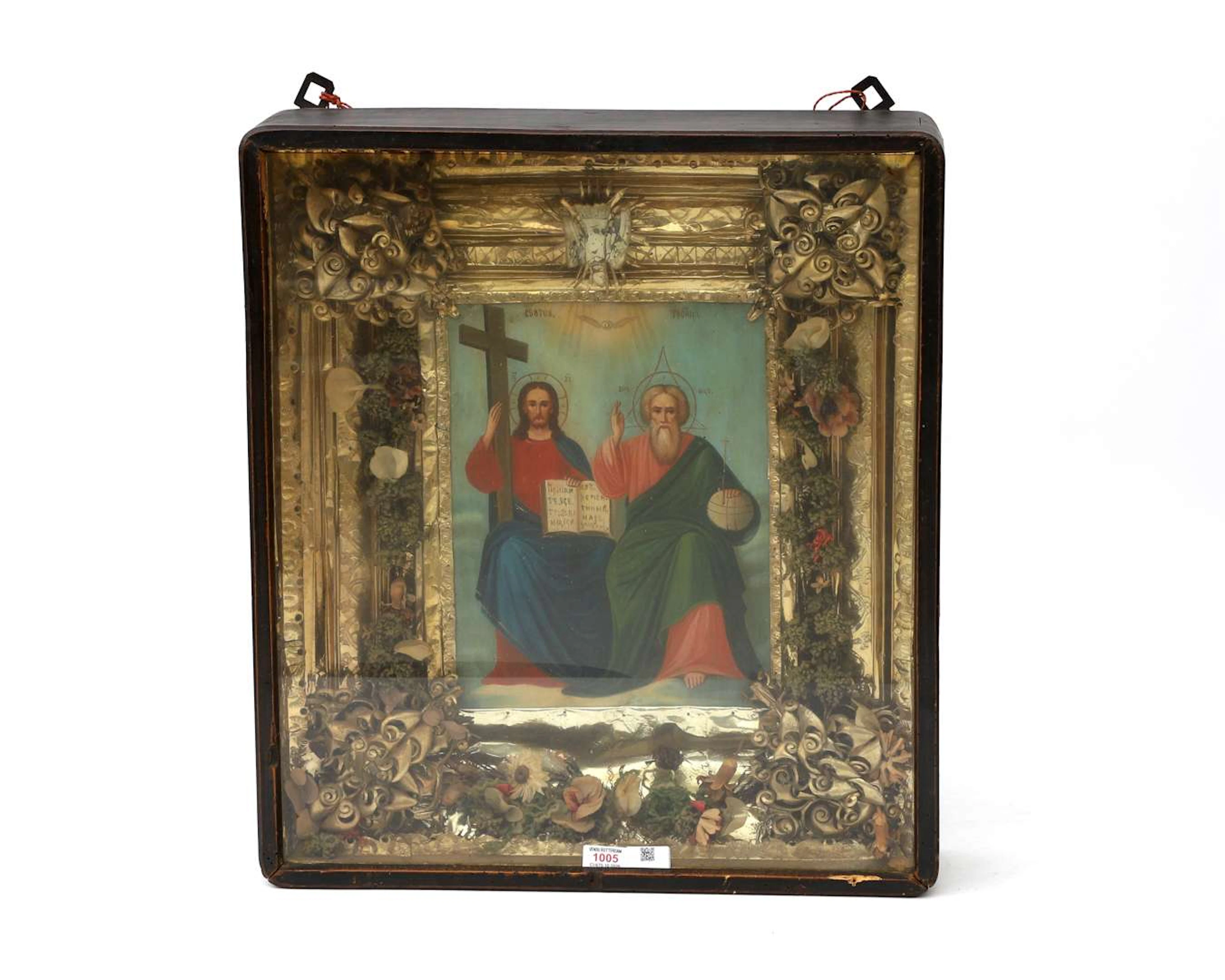 An icon with a gilded metal frame behind glass. Russia, 19th/20th century