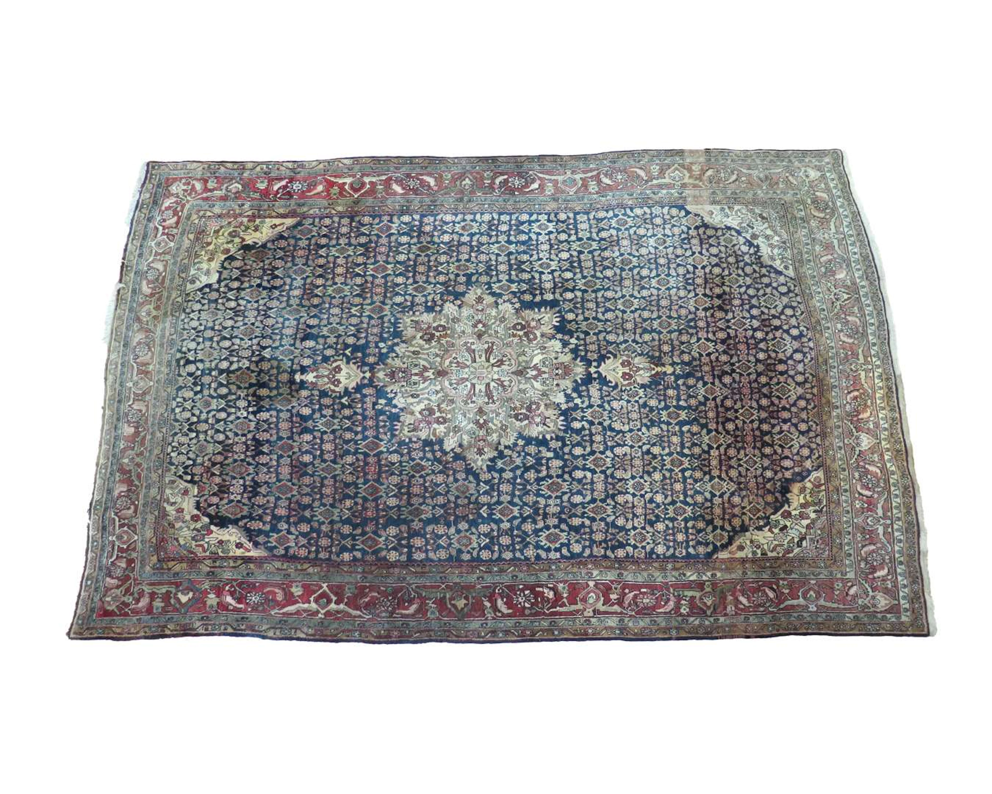 An Oriental rug. Kerman. Dimensions: approx. 345 x 254 cm.
