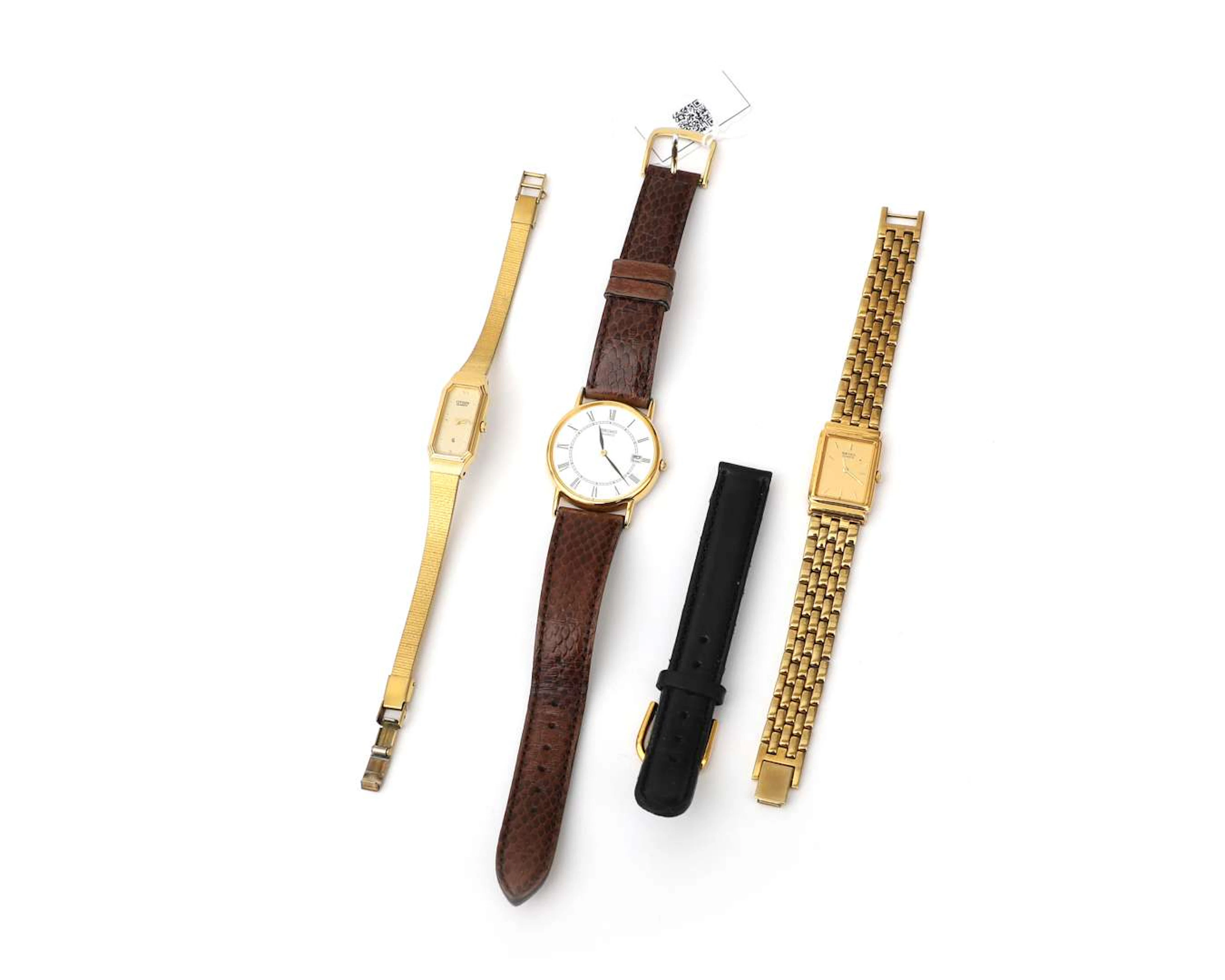 Two Seiko wristwatches, a Citizen ladies’ wristwatch and a spare leather strap