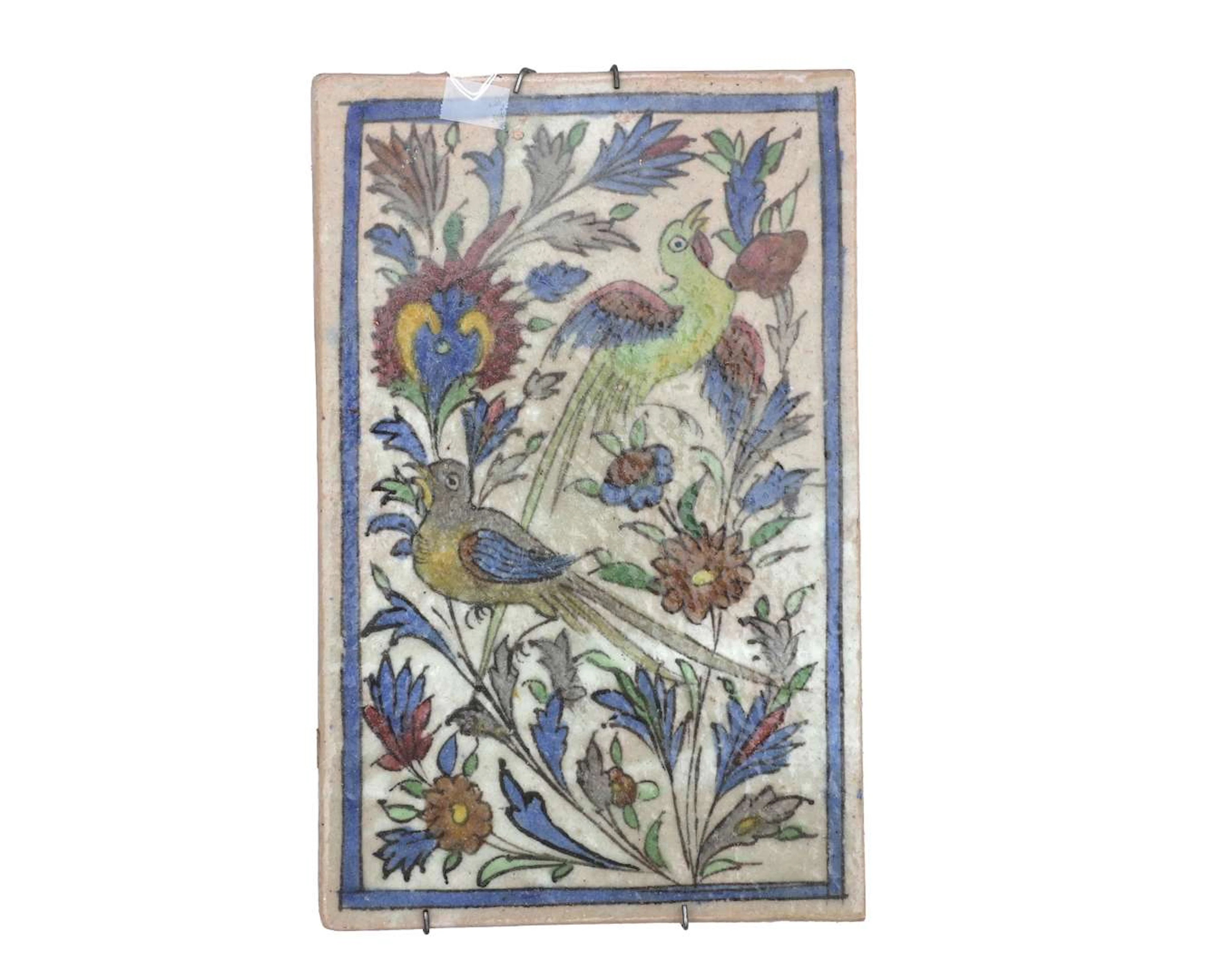A coloured ceramic tile. Iznik design featuring birds and flowers