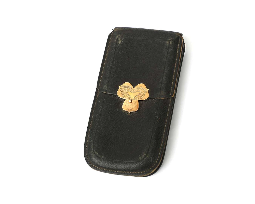 A leather wallet with a 14-carat yellow gold clasp, the Netherlands