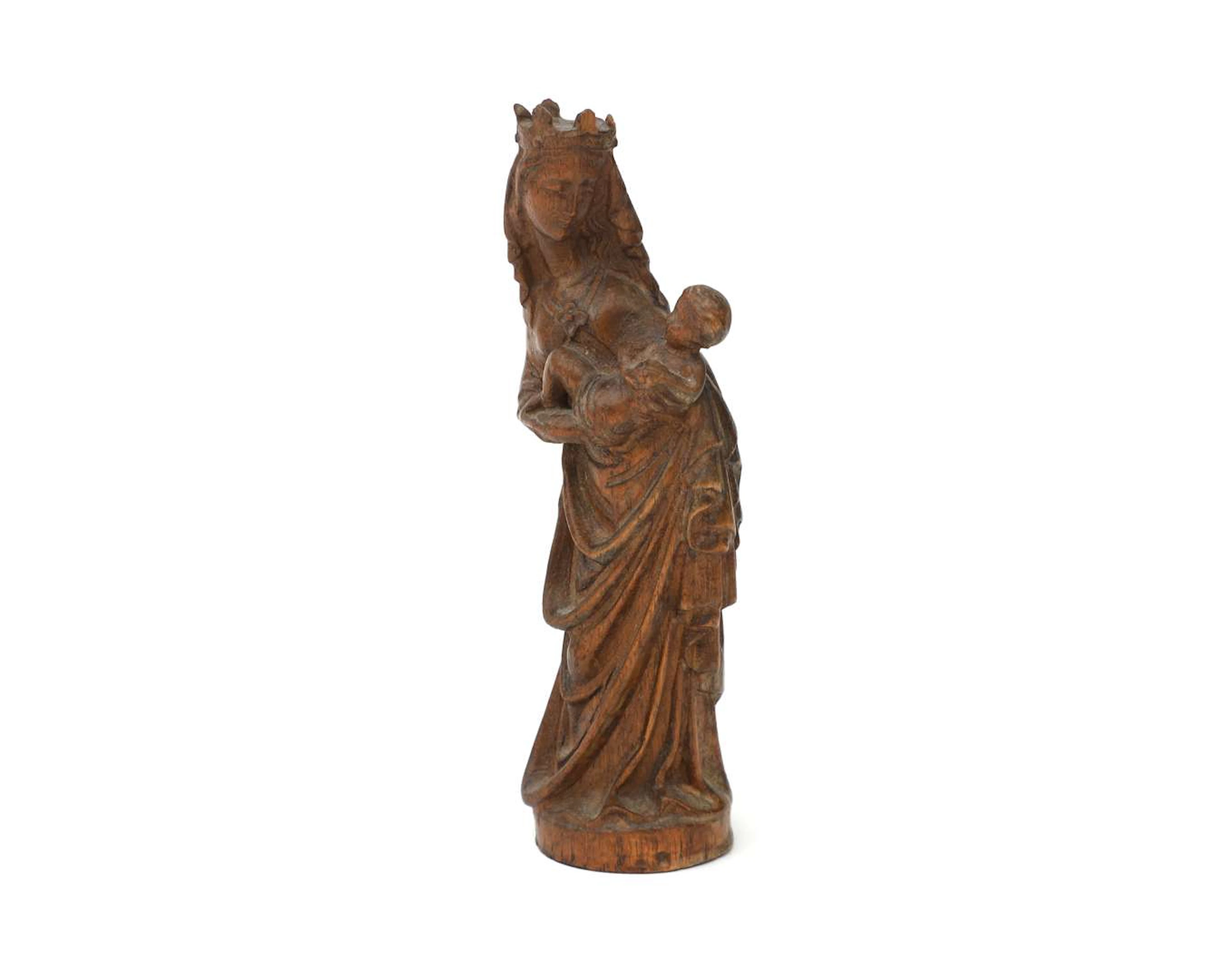 A wooden statue of the Virgin and Child