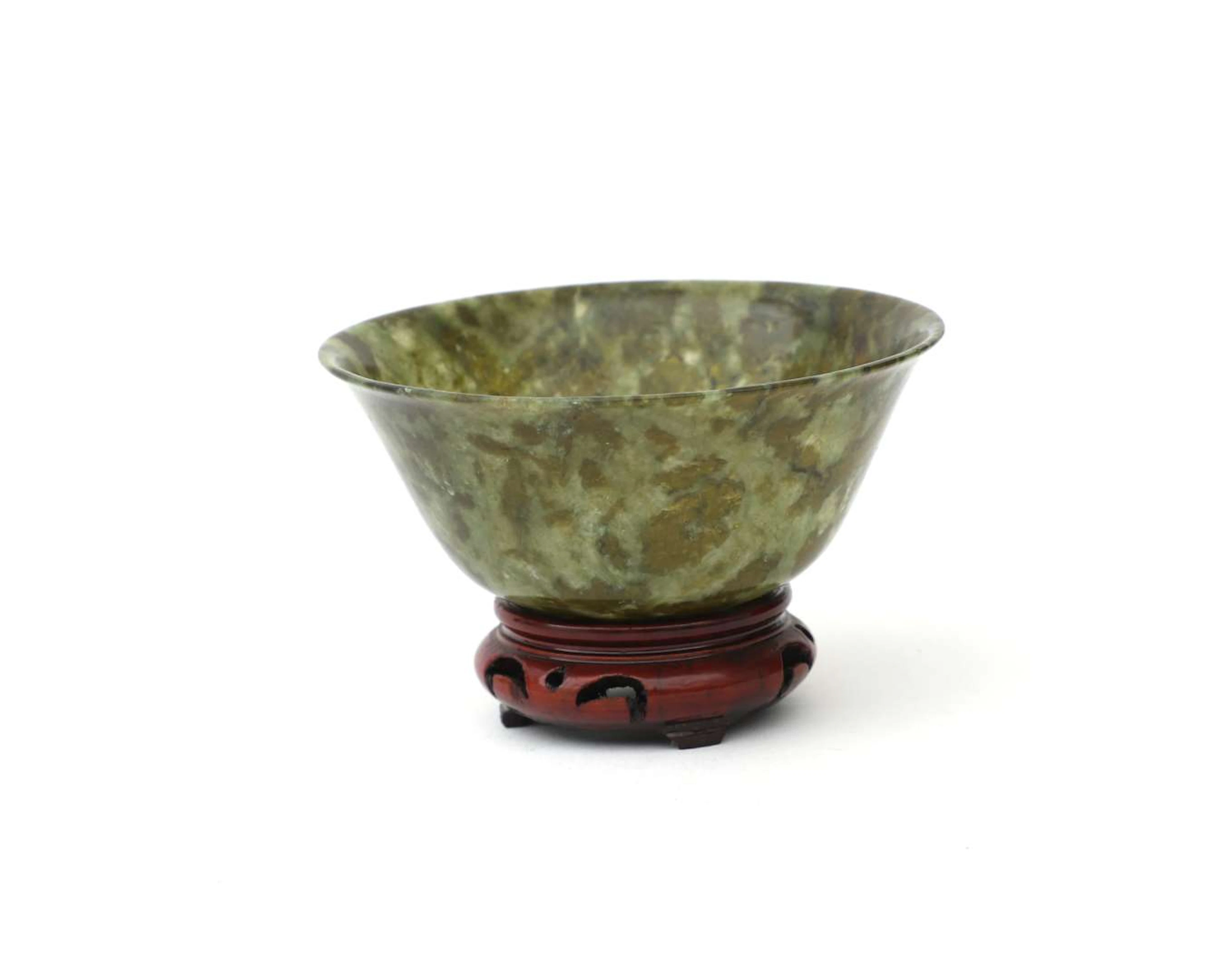 A small green jadeite bowl, China, 20th century