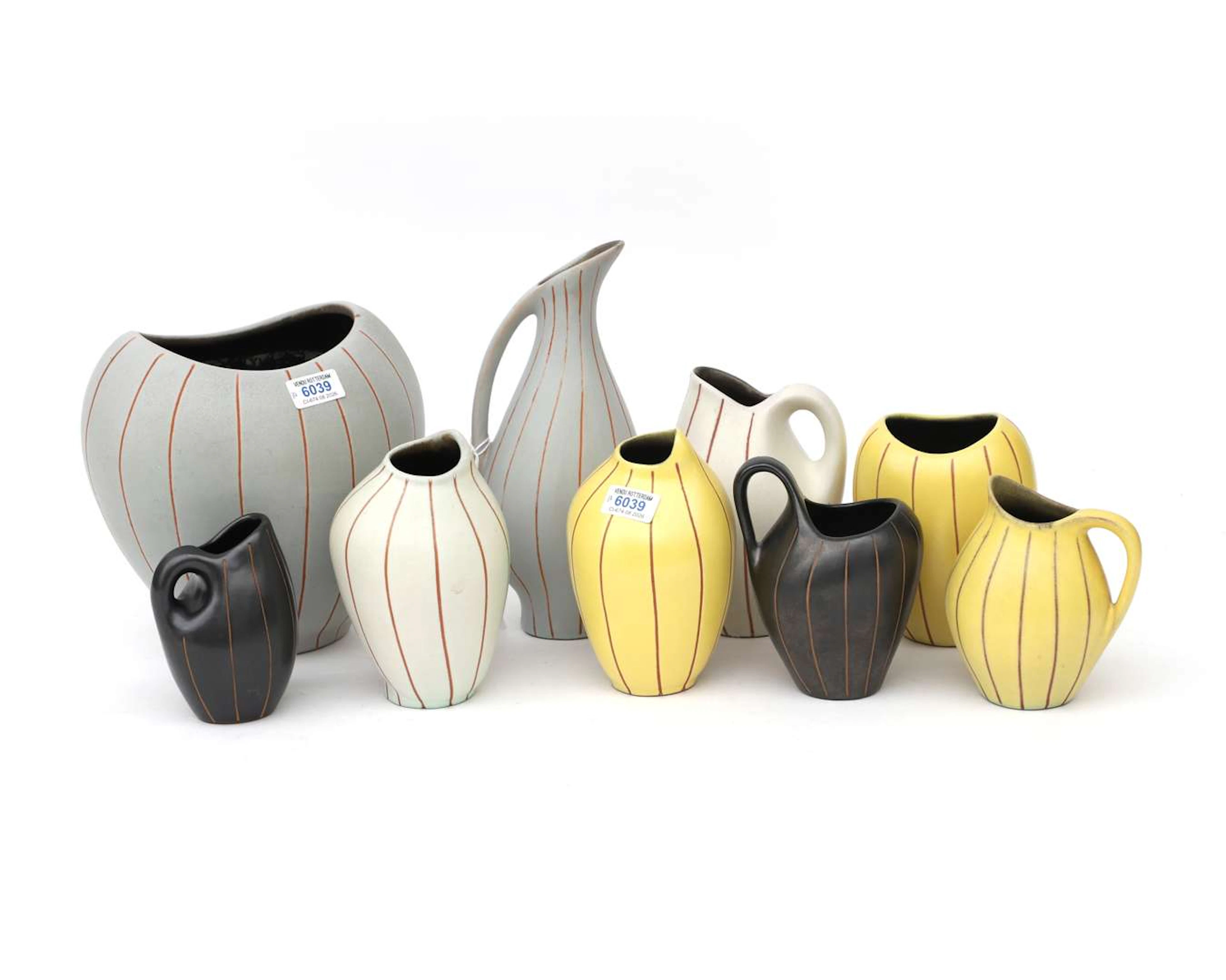 Nine assorted ceramic vases and similar items. Fritz van Daalen, West