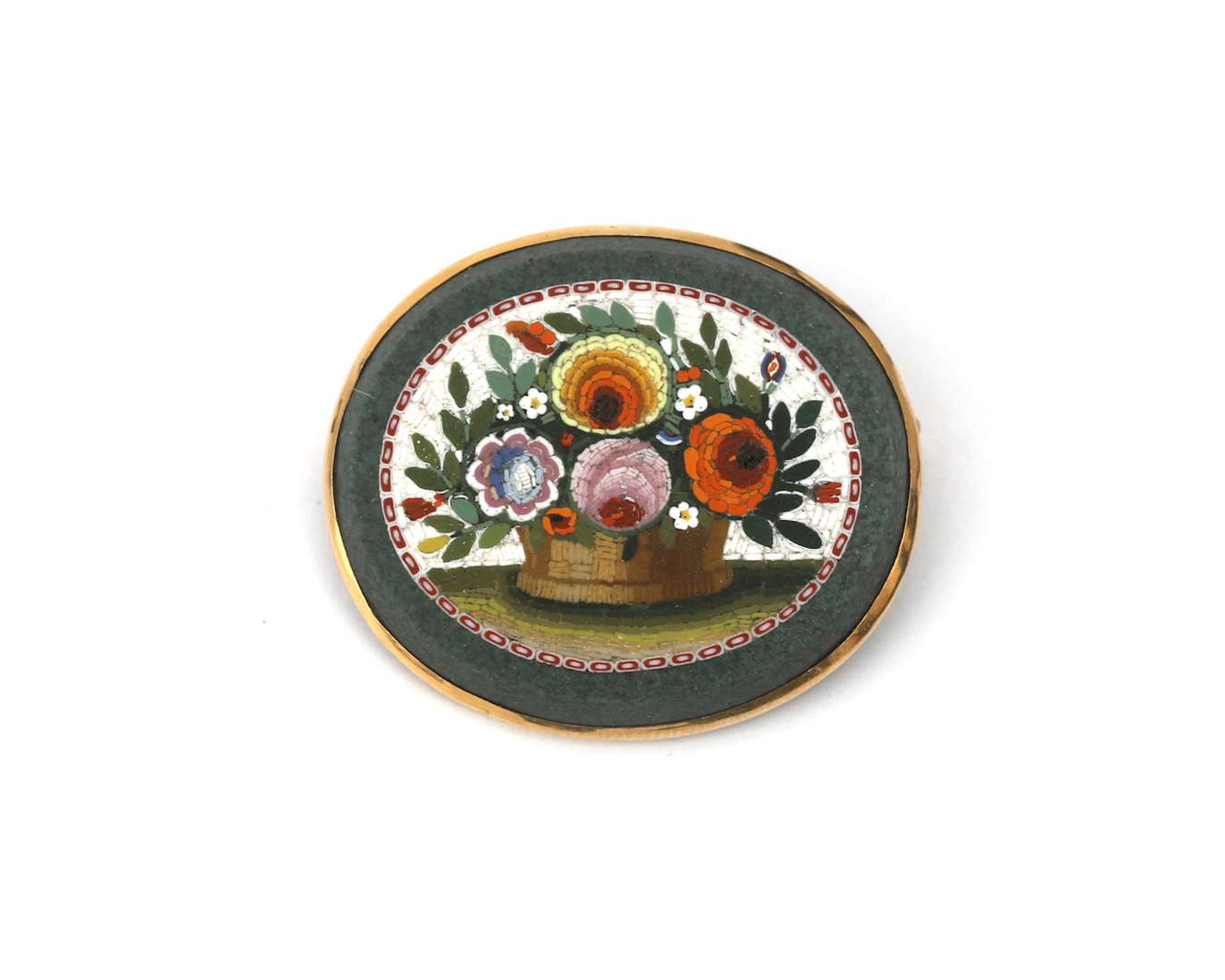 A 14k yellow gold oval brooch with a micro-mosaic