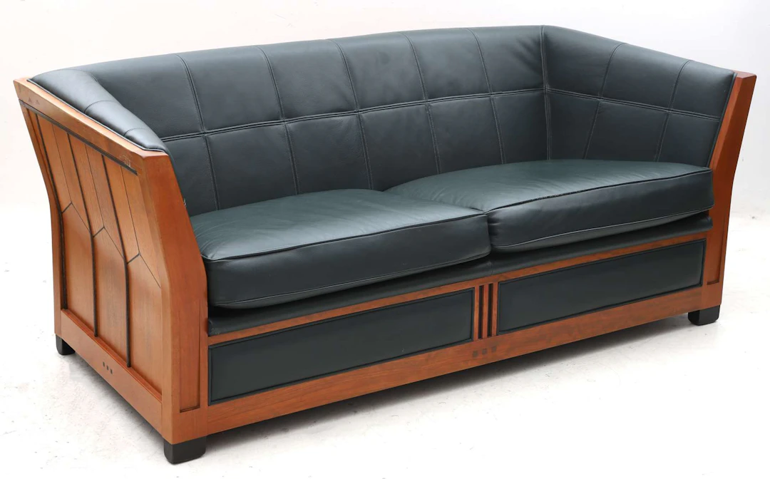 An Art Deco-style two-seater sofa in bubinga wood. Schuitema Decoforma