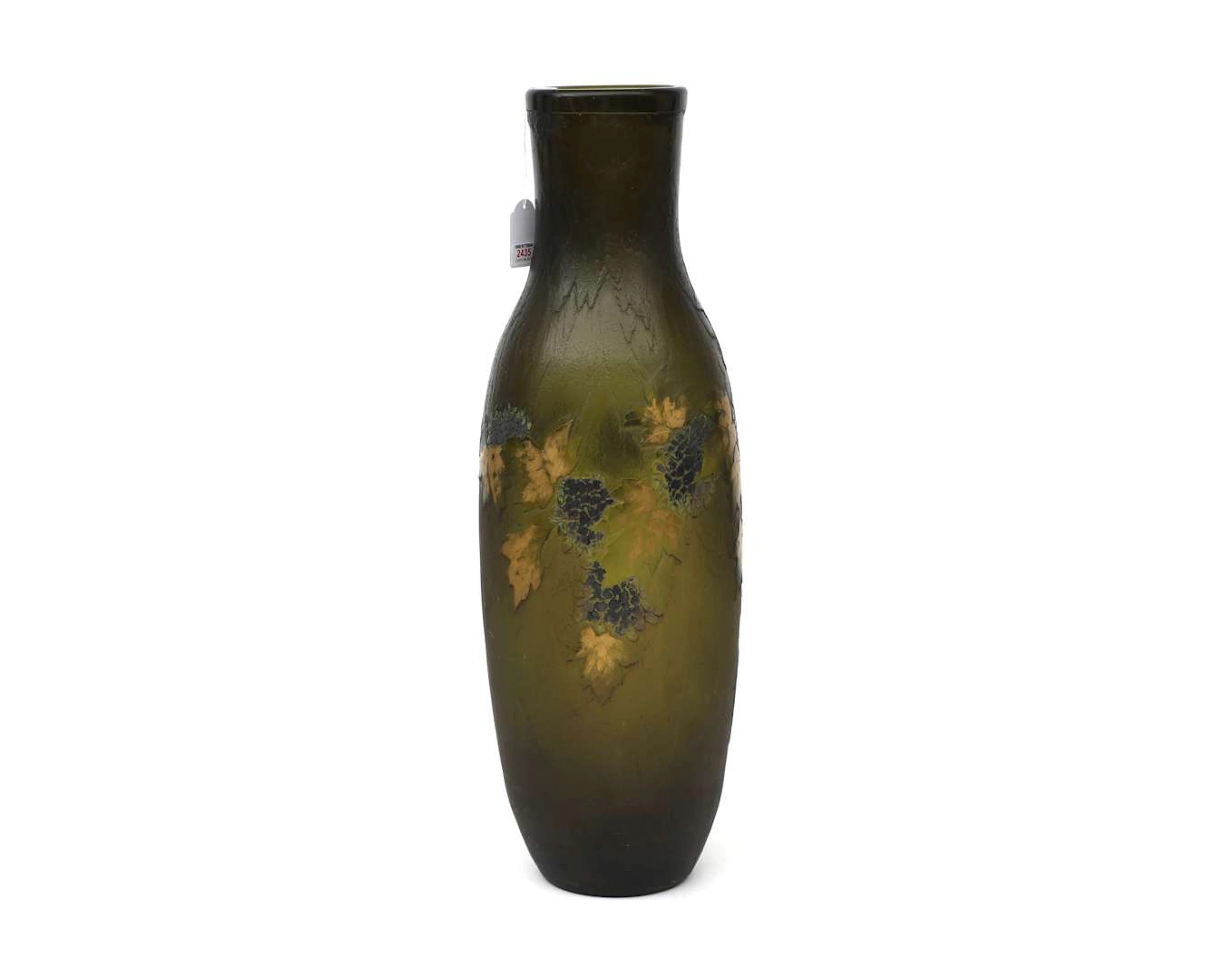 A large green glass vase with etched decor involving gold leaf motifs