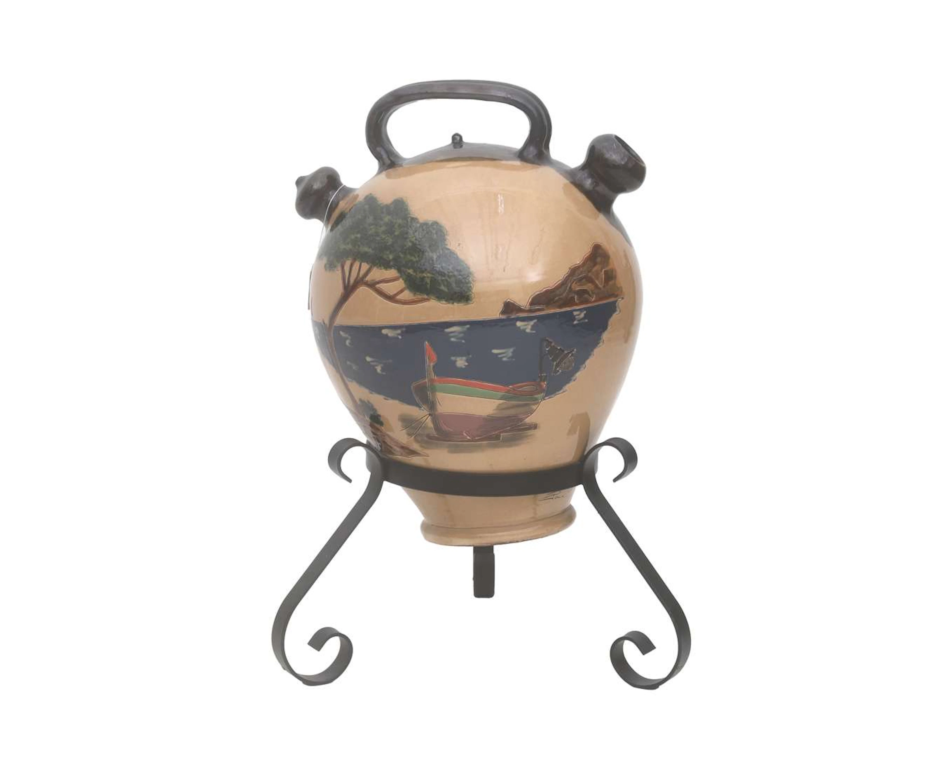 An earthenware Mediterranean water cooler on wrought iron base