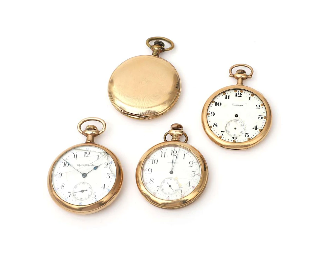 A lot comprising four gold-plated pocket watches