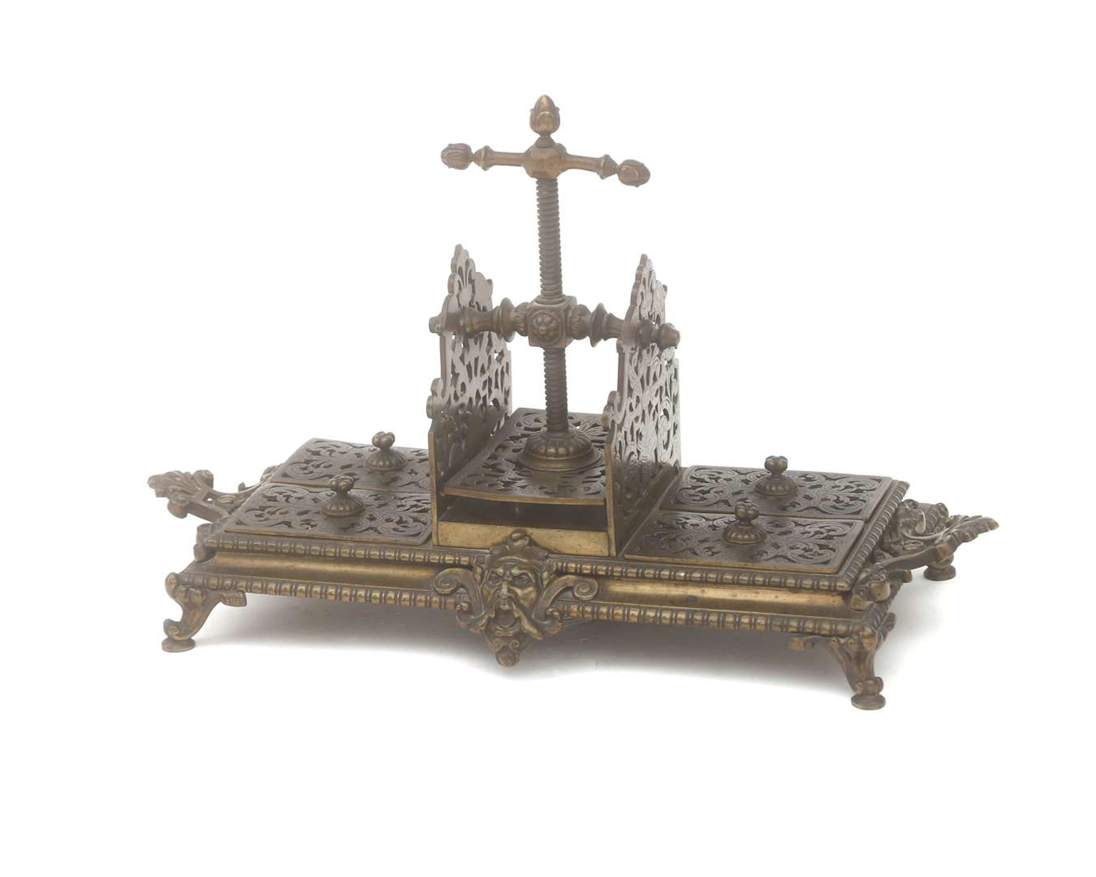 A bronze card press with game chips, 2nd half 19th century