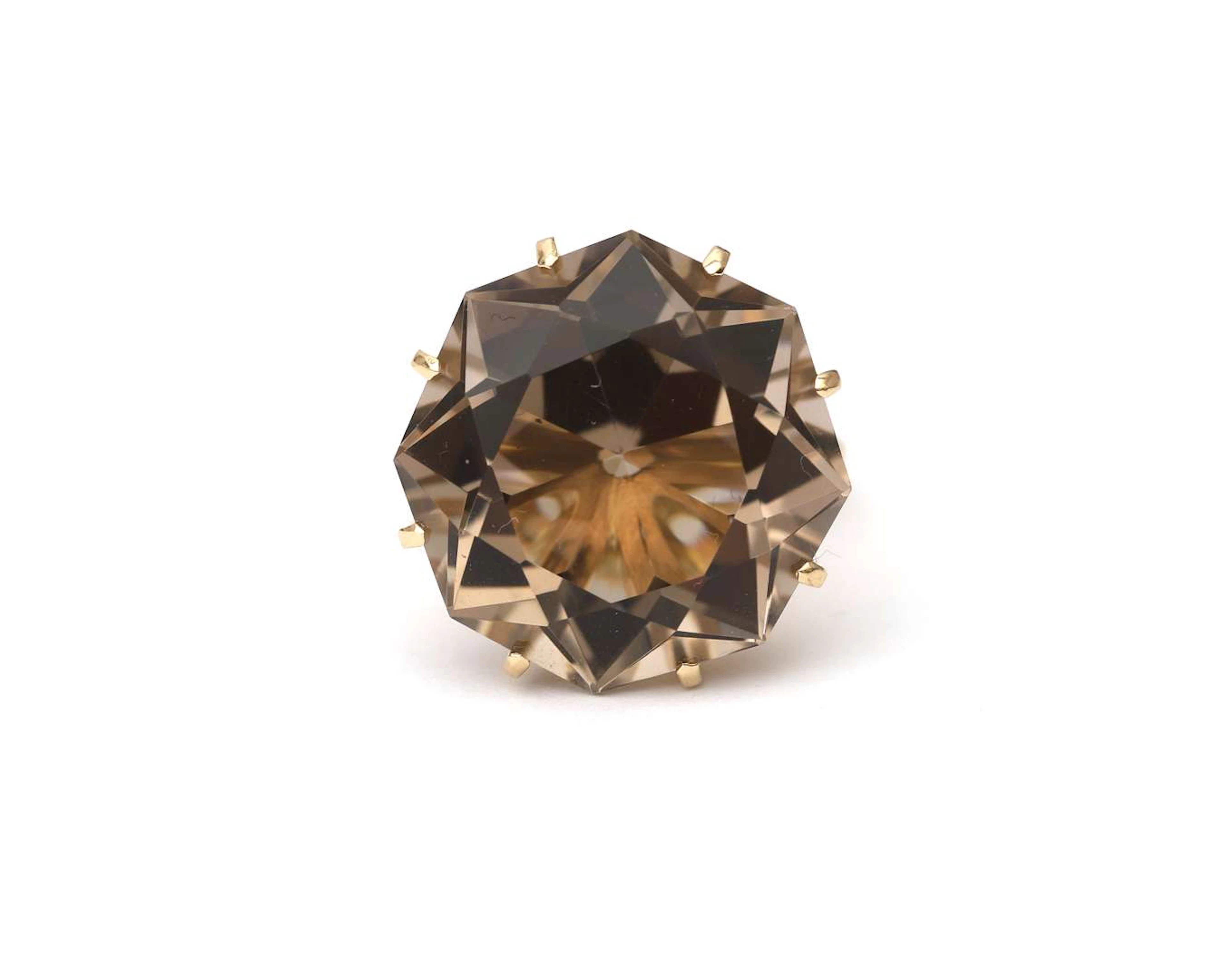 A 14k yellow gold ring with smoky quartz