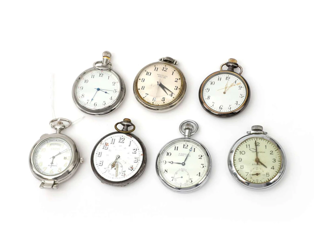 Seven pocket watches with steel cases