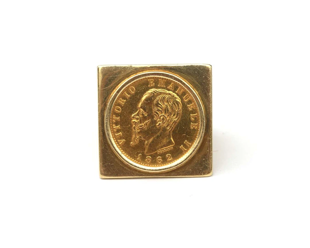 A 14k yellow gold ring featuring a coin of Vittorio Emanuele