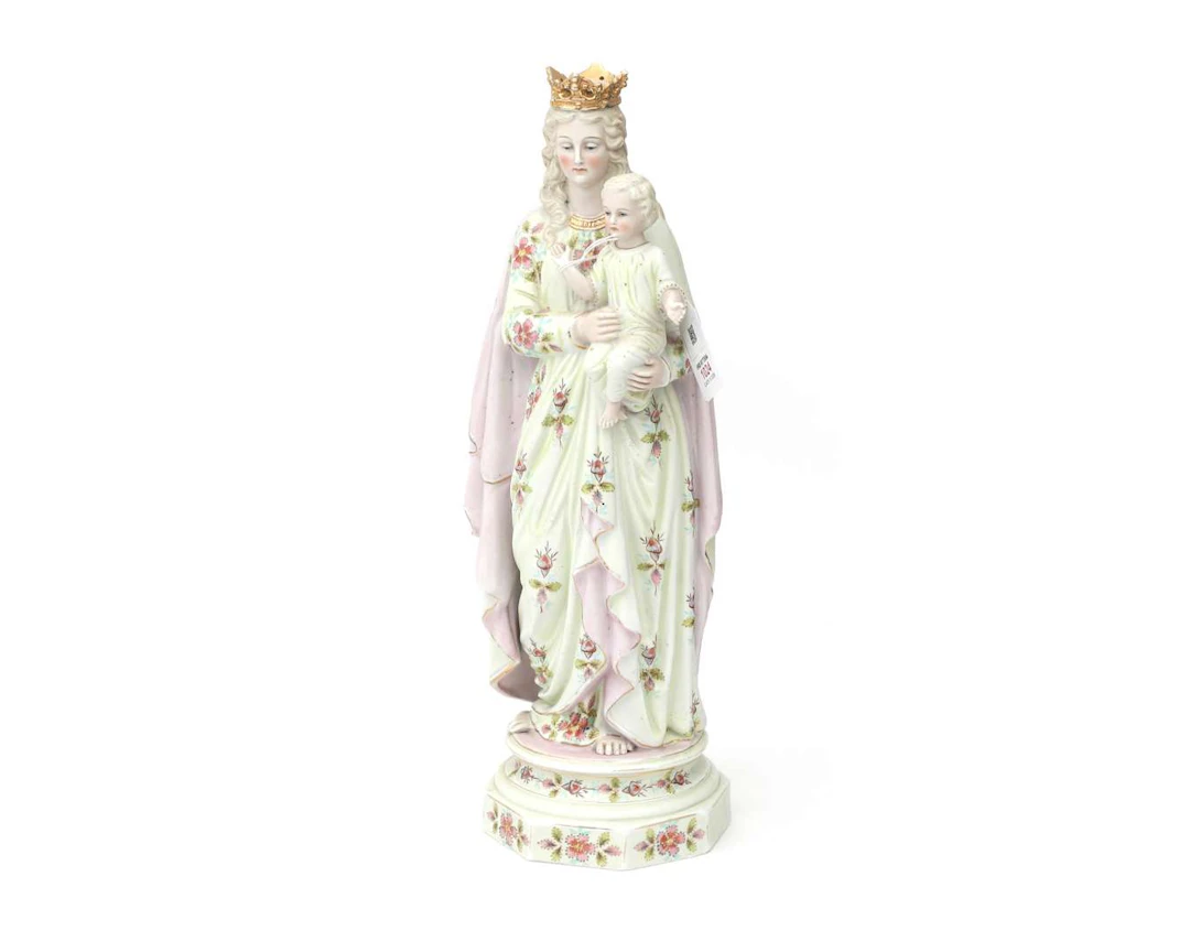A bisque porcelain statue of the Virgin Mary with the Child Jesus