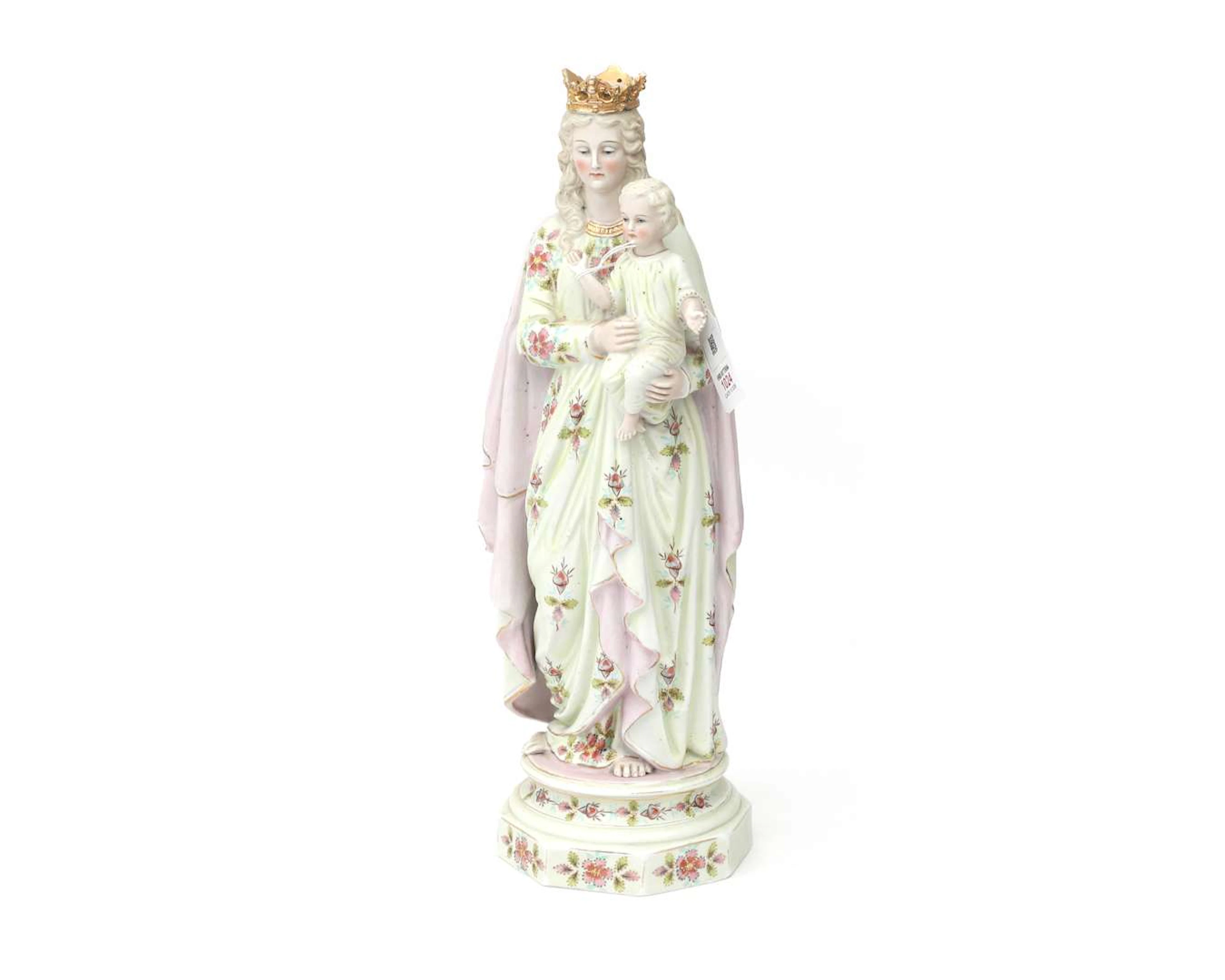 A bisque porcelain statue of the Virgin Mary with the Child Jesus