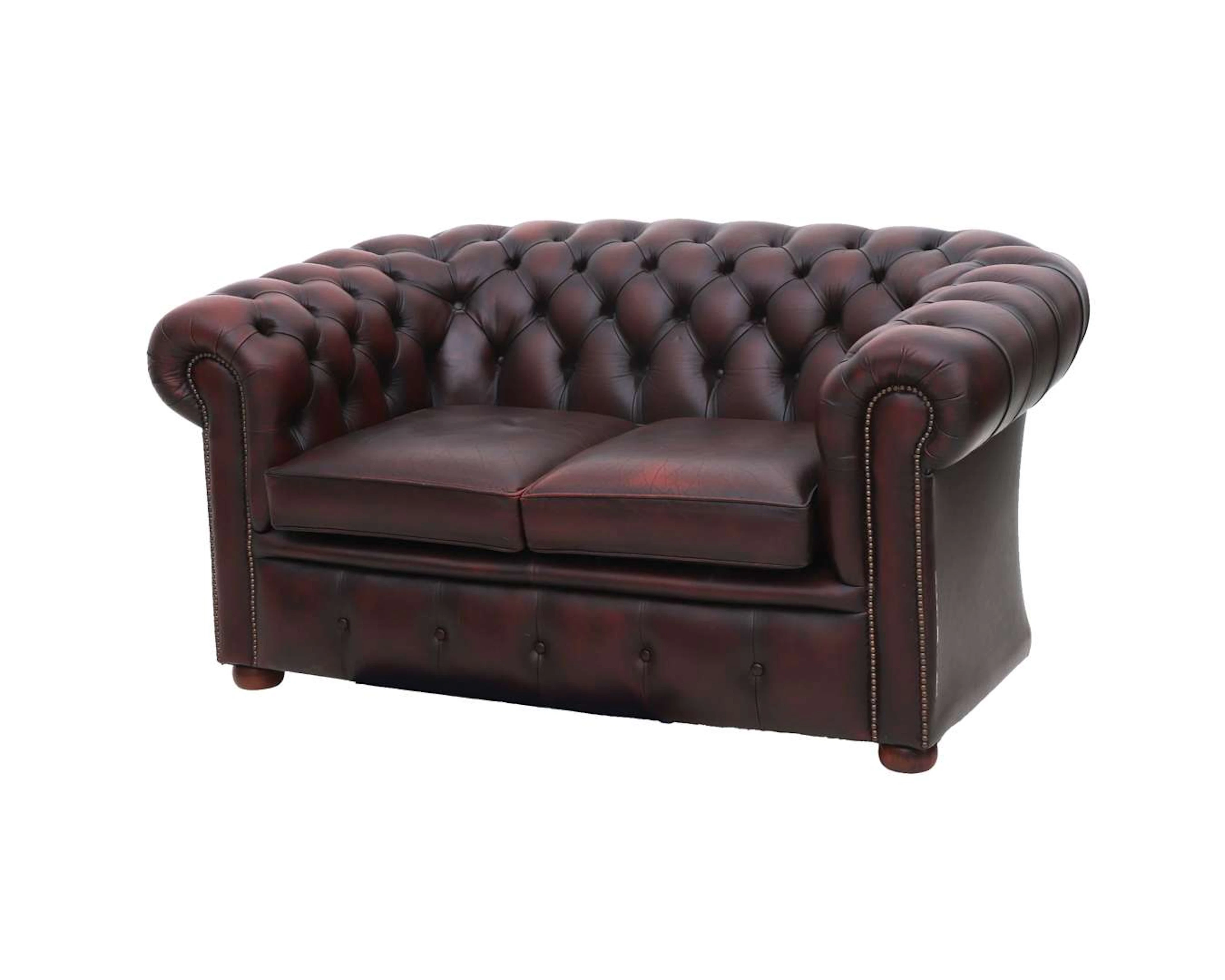 A Chesterfield-style two-seater sofa, 20th century