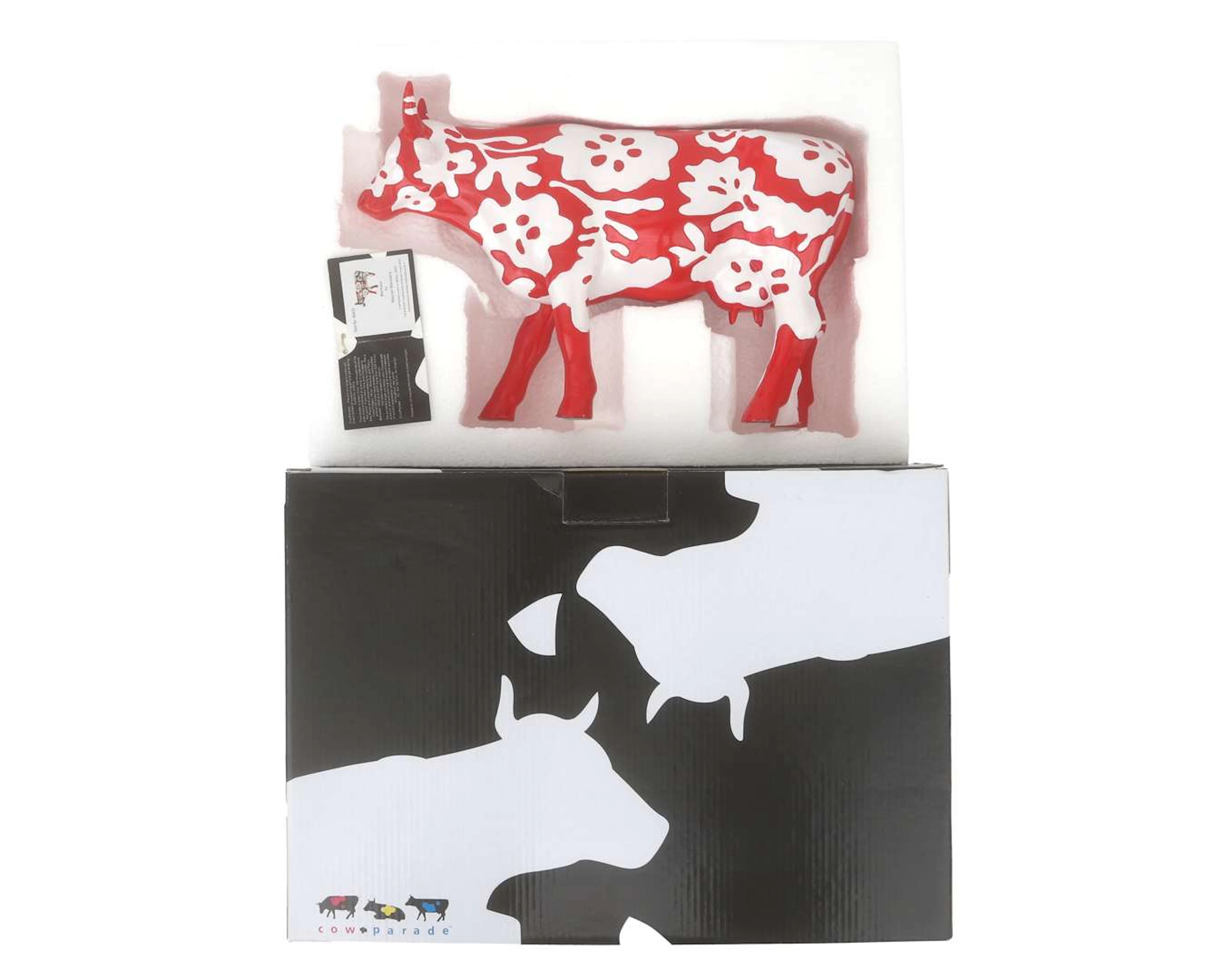 A red and white plastic cow, model Bertuno, designed by Marcel Wanders 2007