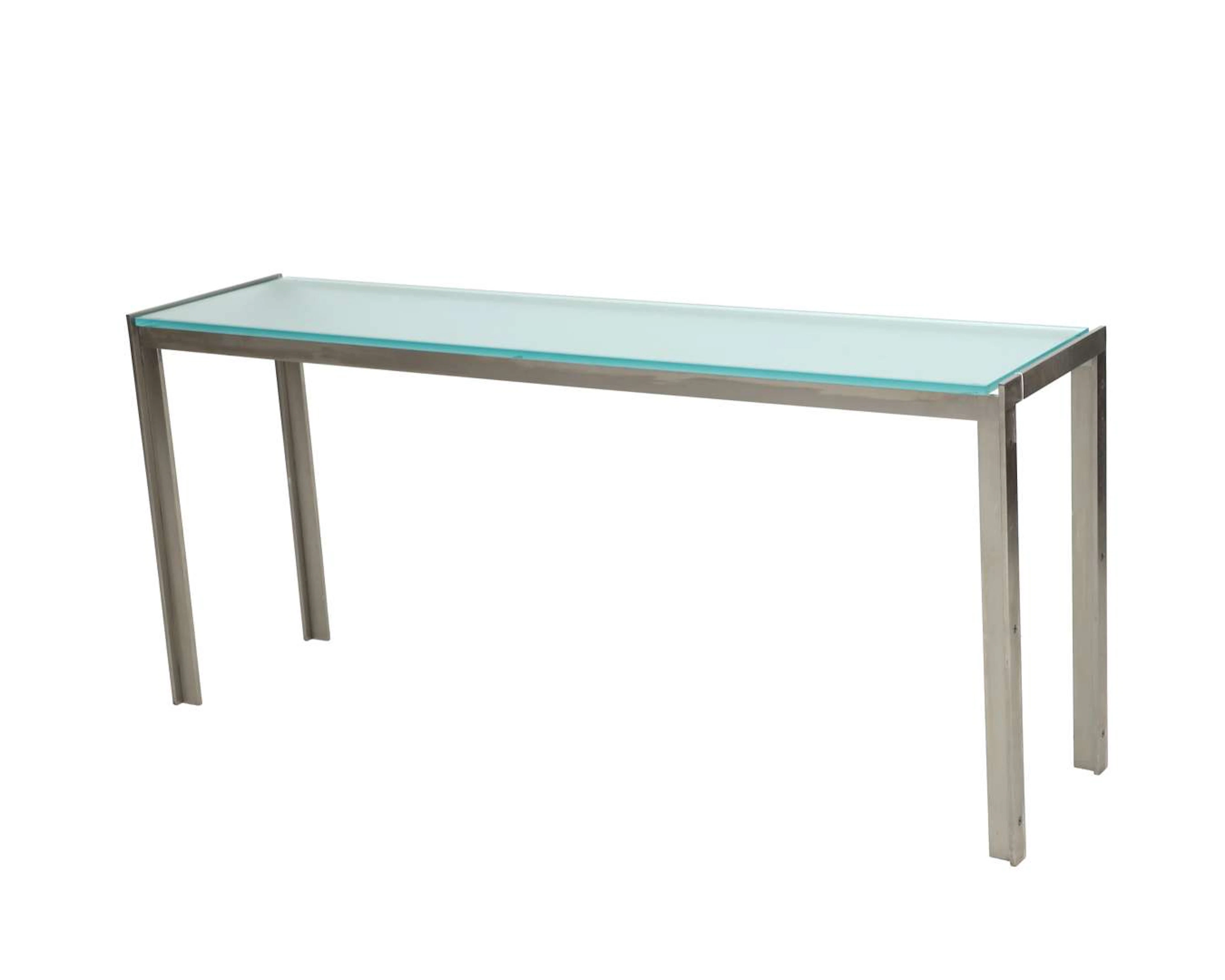 A stainless steel wall-mounted table with a glass top. 20th/21st century