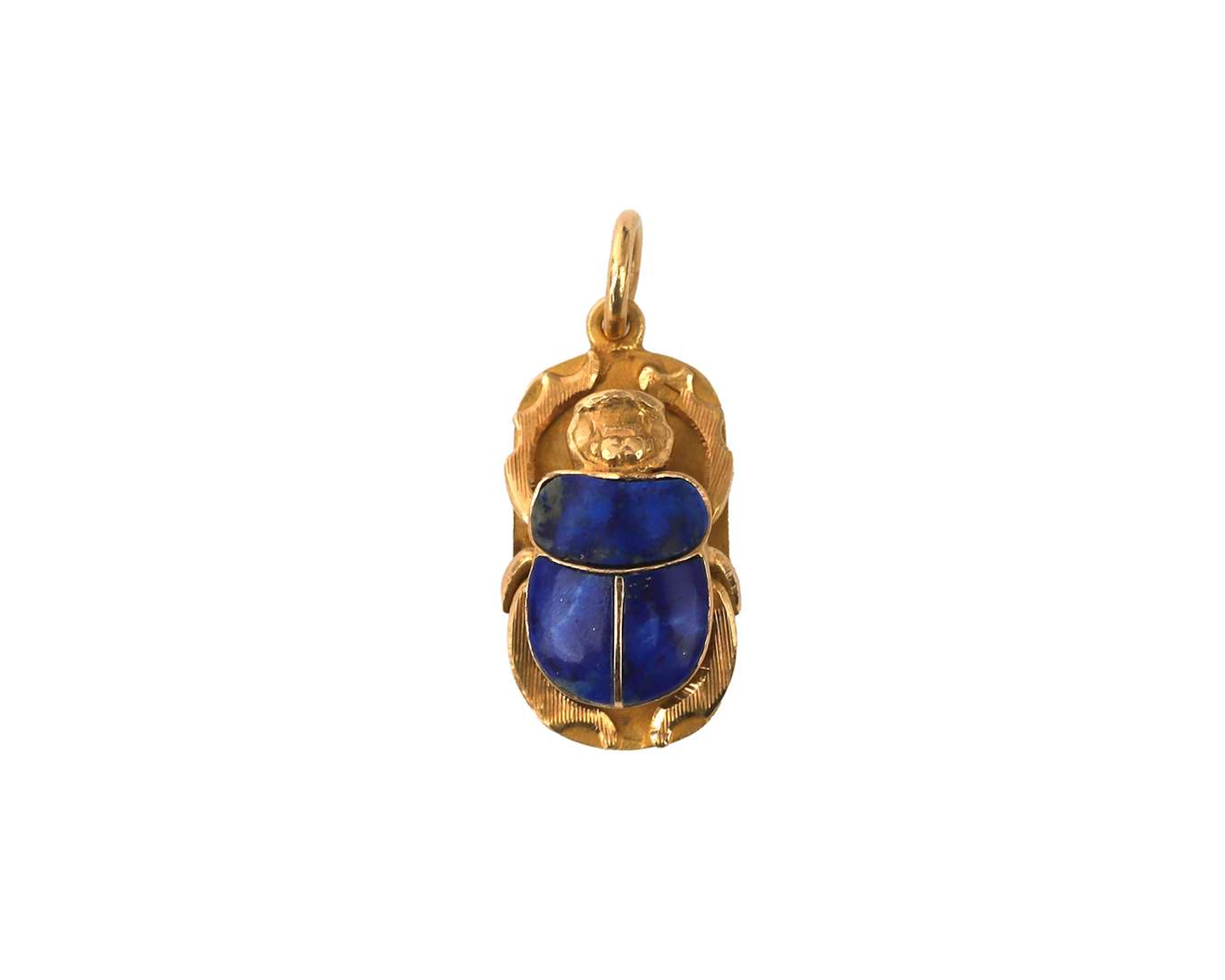 An 18k yellow gold scarab pendant with lapis lazuli