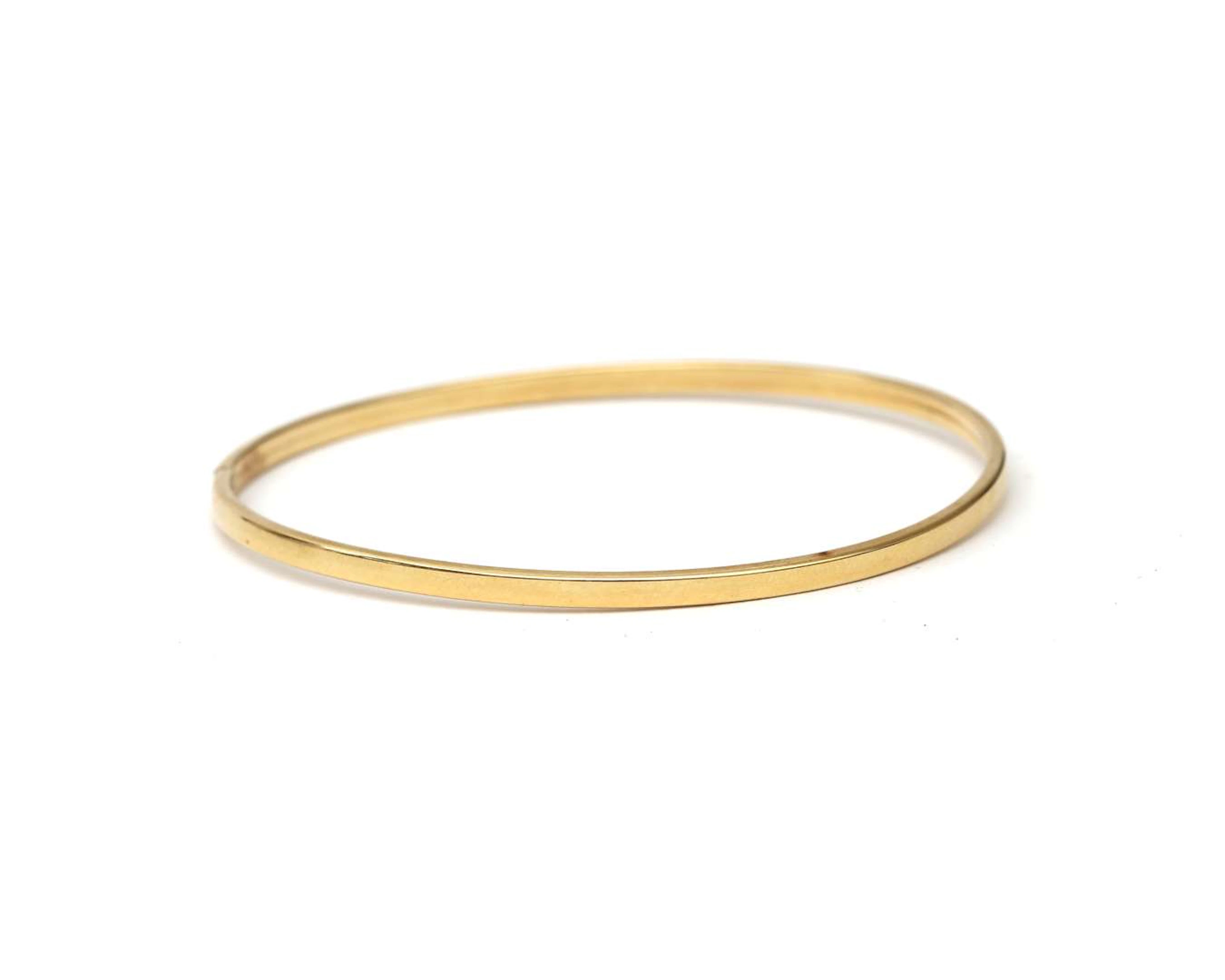 A 14 crt. yellow gold bangle bracelet