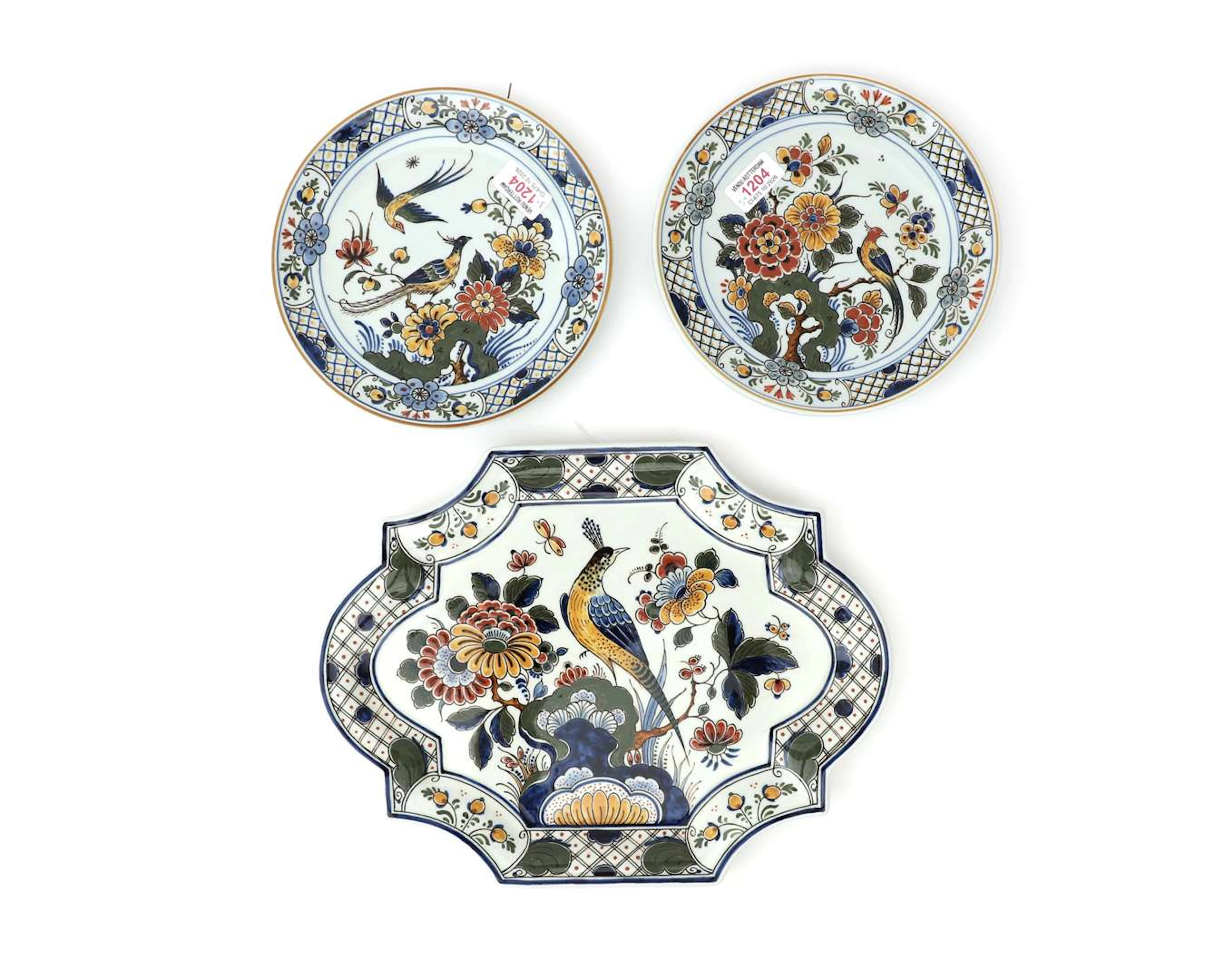 Three polychrome earthenware wall plates, De Porceleyne Fles, Delft