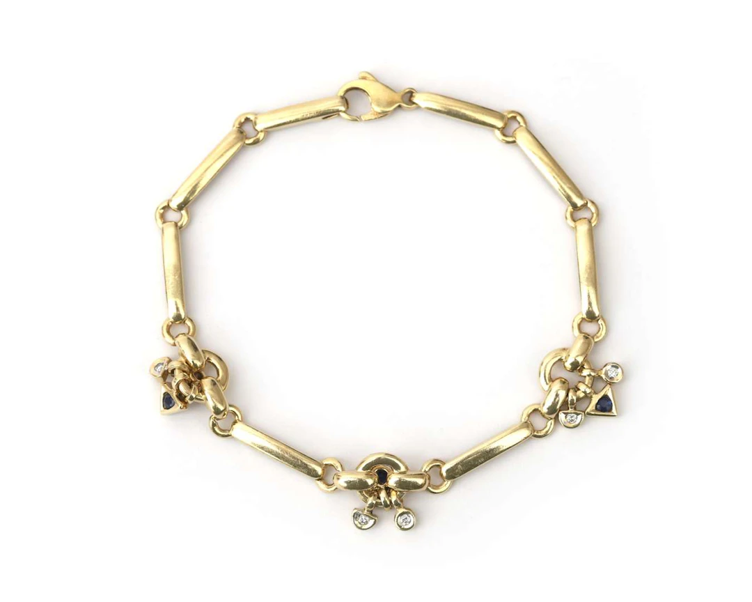 A 14-carat yellow gold link bracelet set with sapphire and diamond