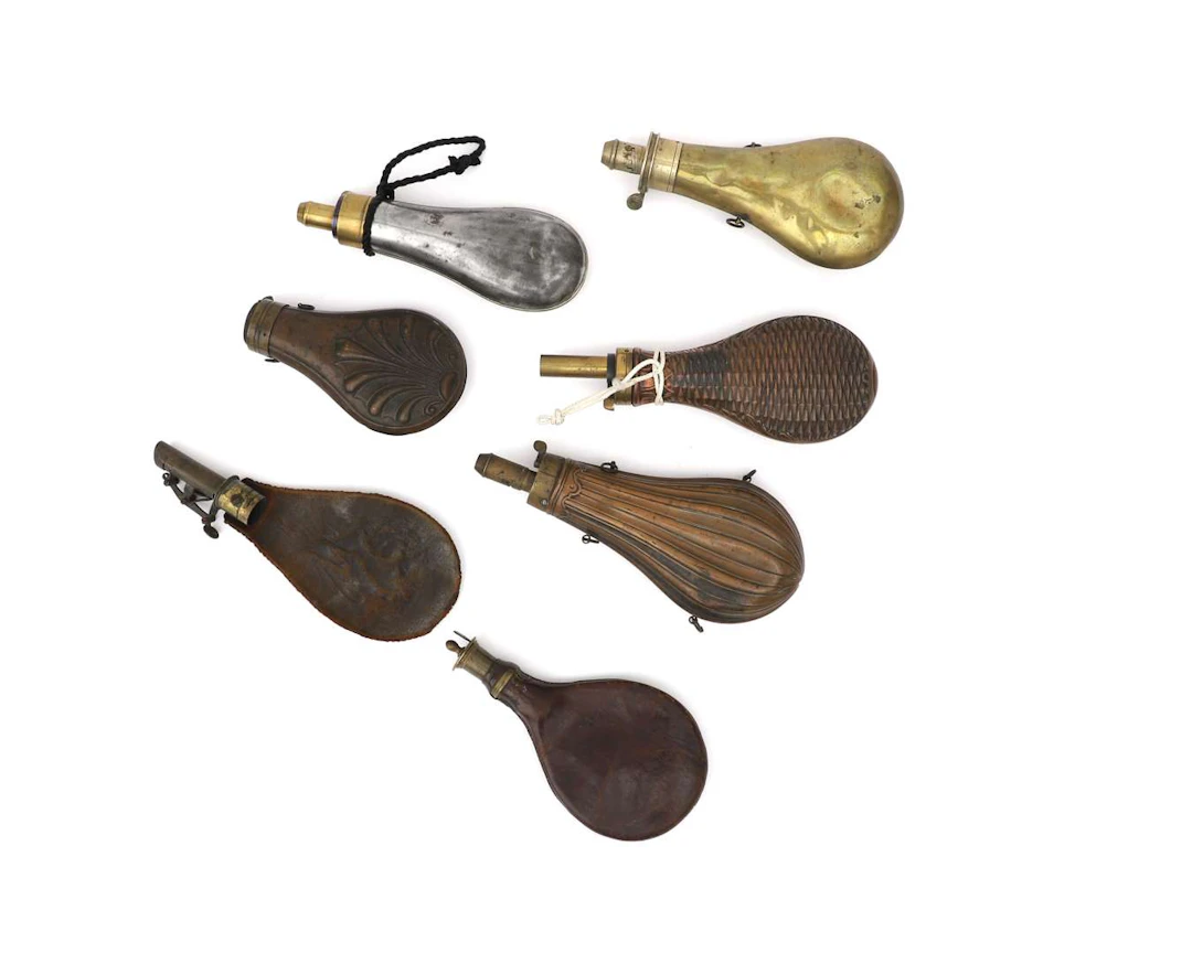 A lot comprising five spice bottles and two bags of shot, 19th century