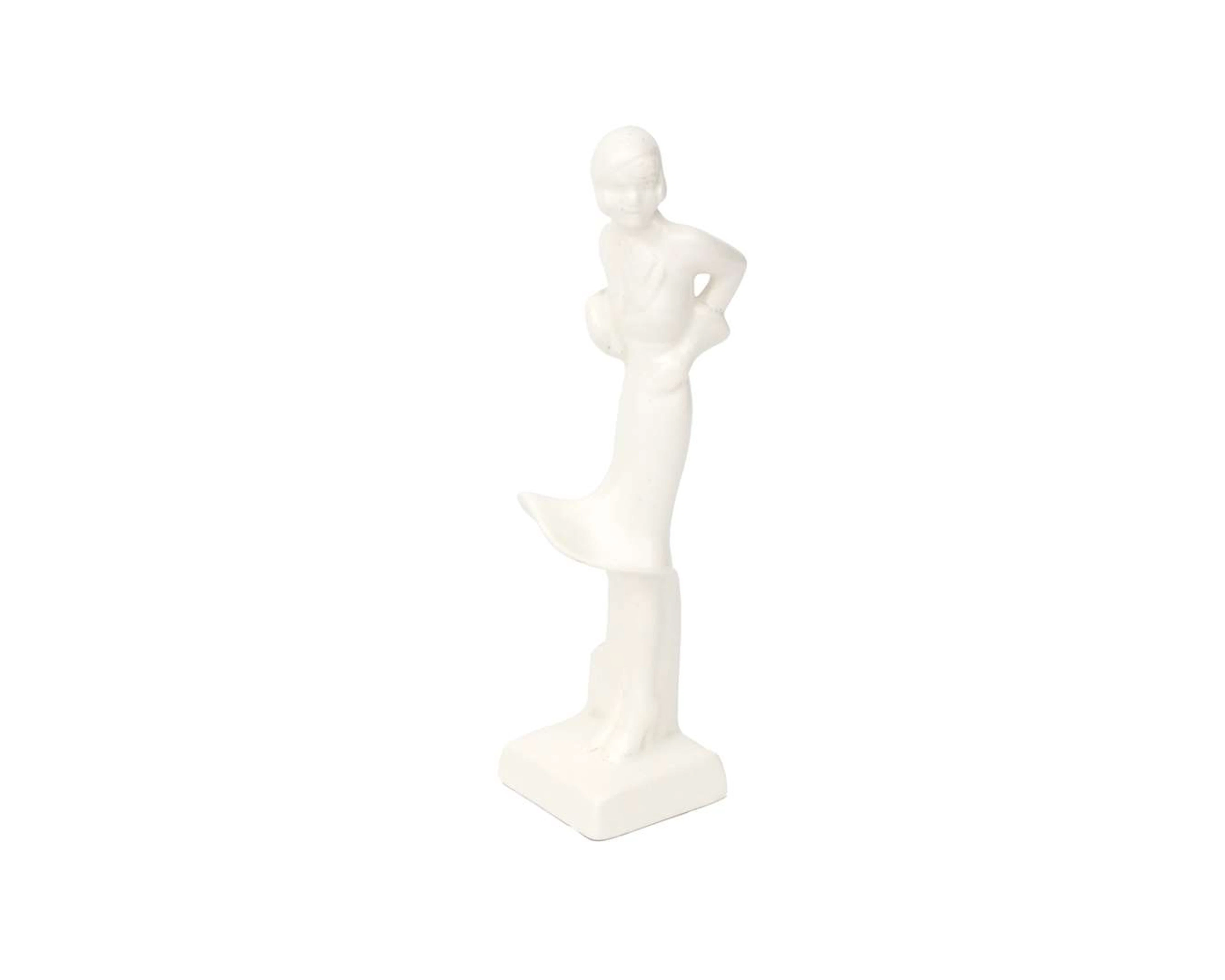 A white earthenware figurine in the shape of a lady, produced by the