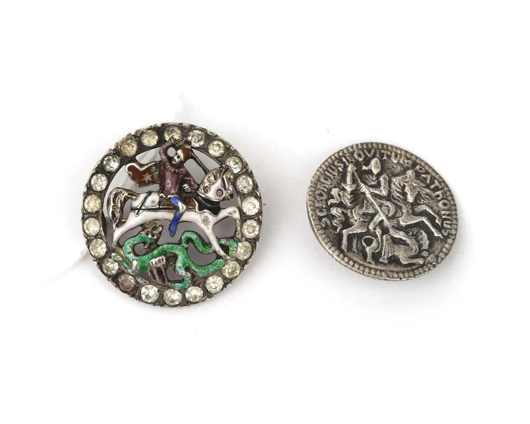 A silver enamelled brooch depicting St George and the dragon