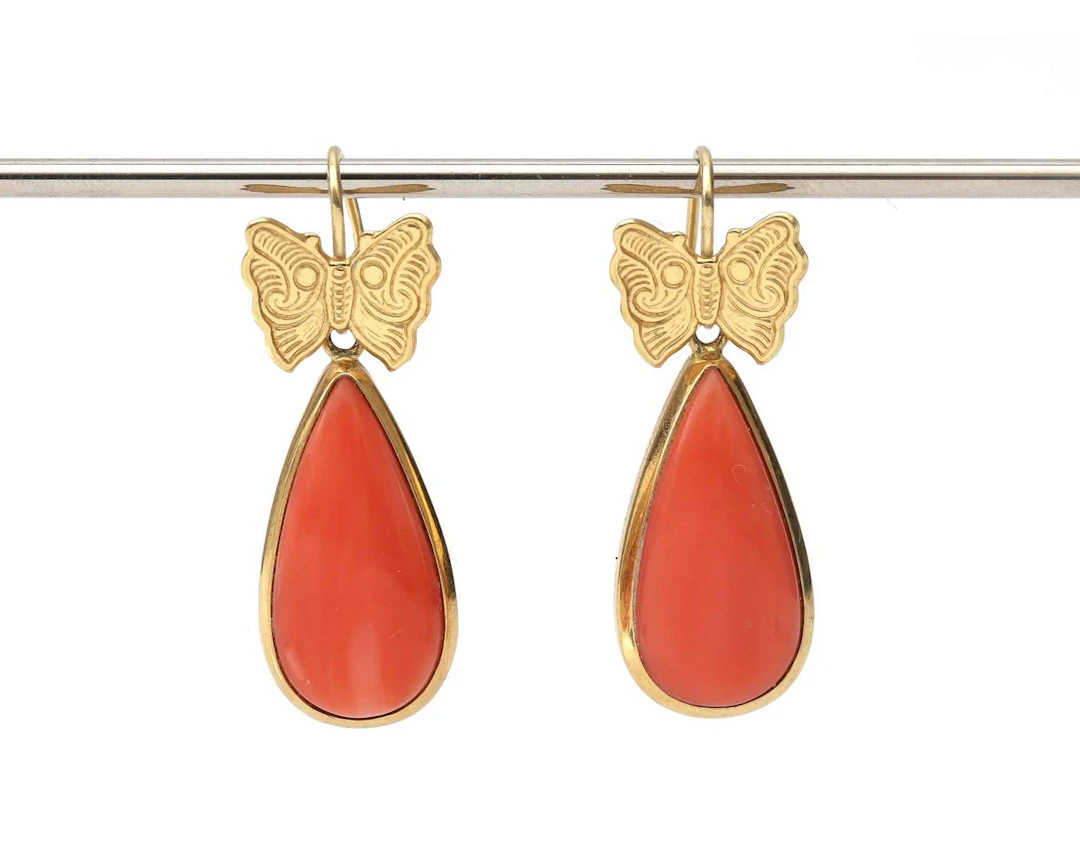 A pair of 18-carat yellow gold drop earrings with coral