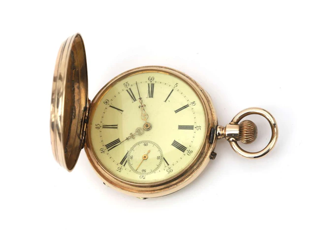 A 14k yellow gold pocket watch with engraved front and back covers