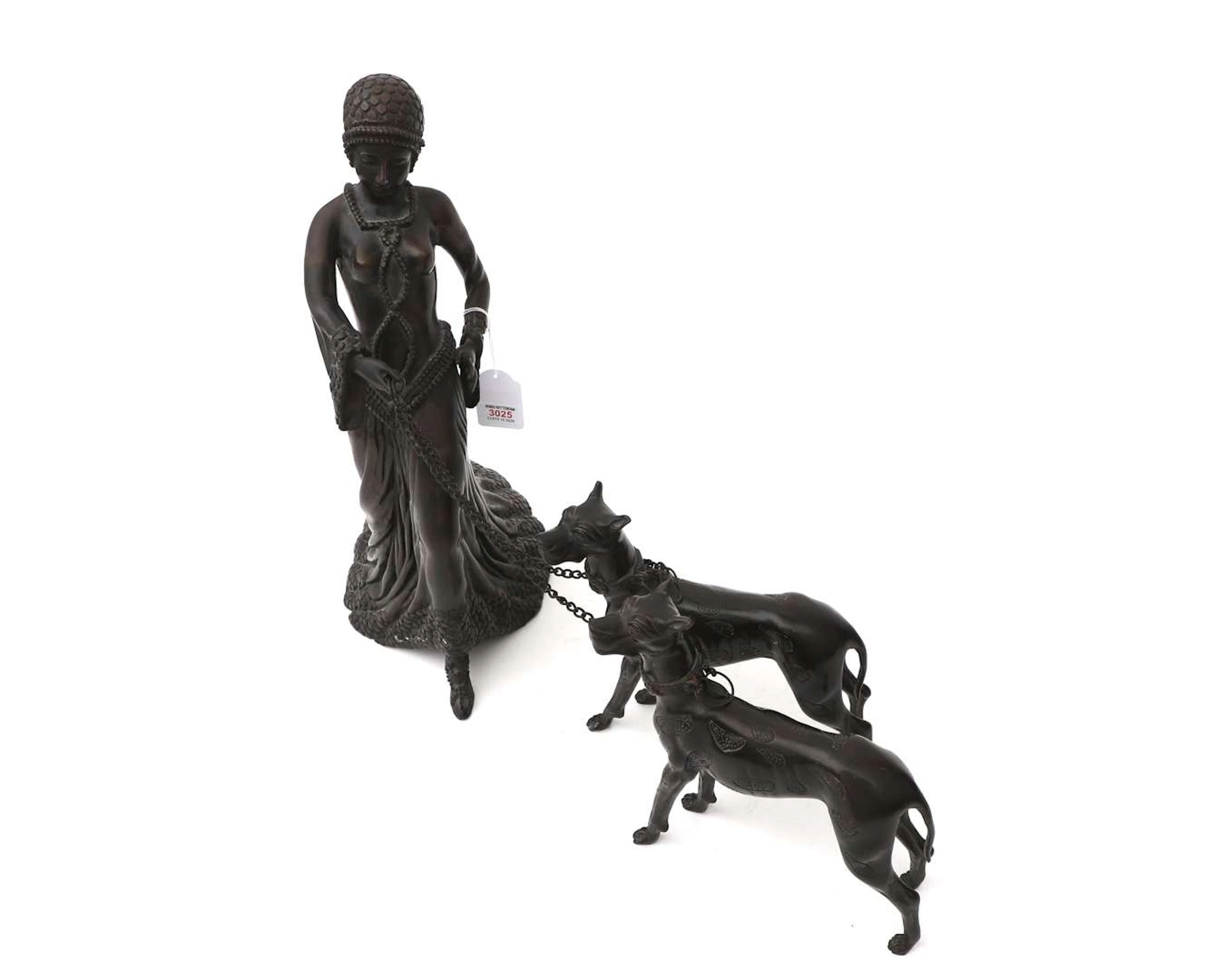 An Art Deco-style bronze sculpture of a lady walking two dogs, 20th century