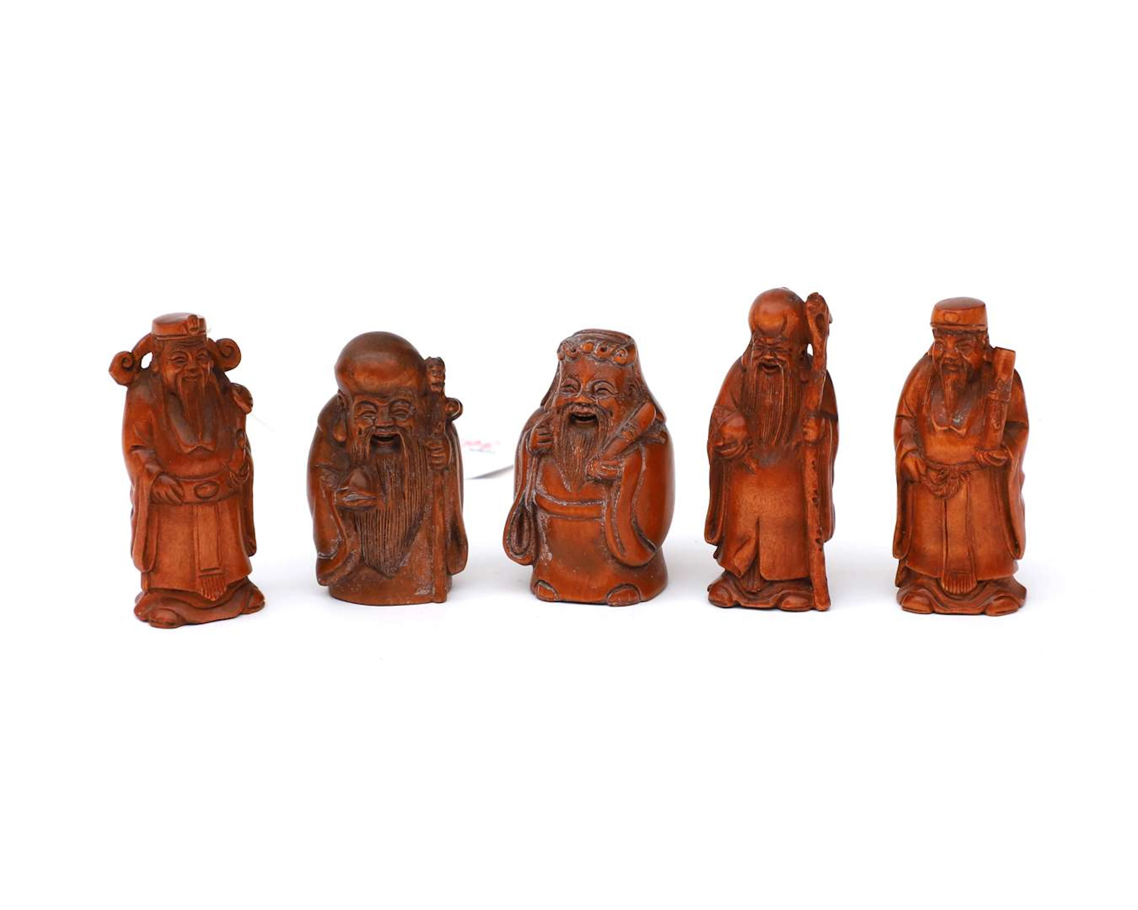 Five wooden netské figurines of various designs. Japan, 20th century.