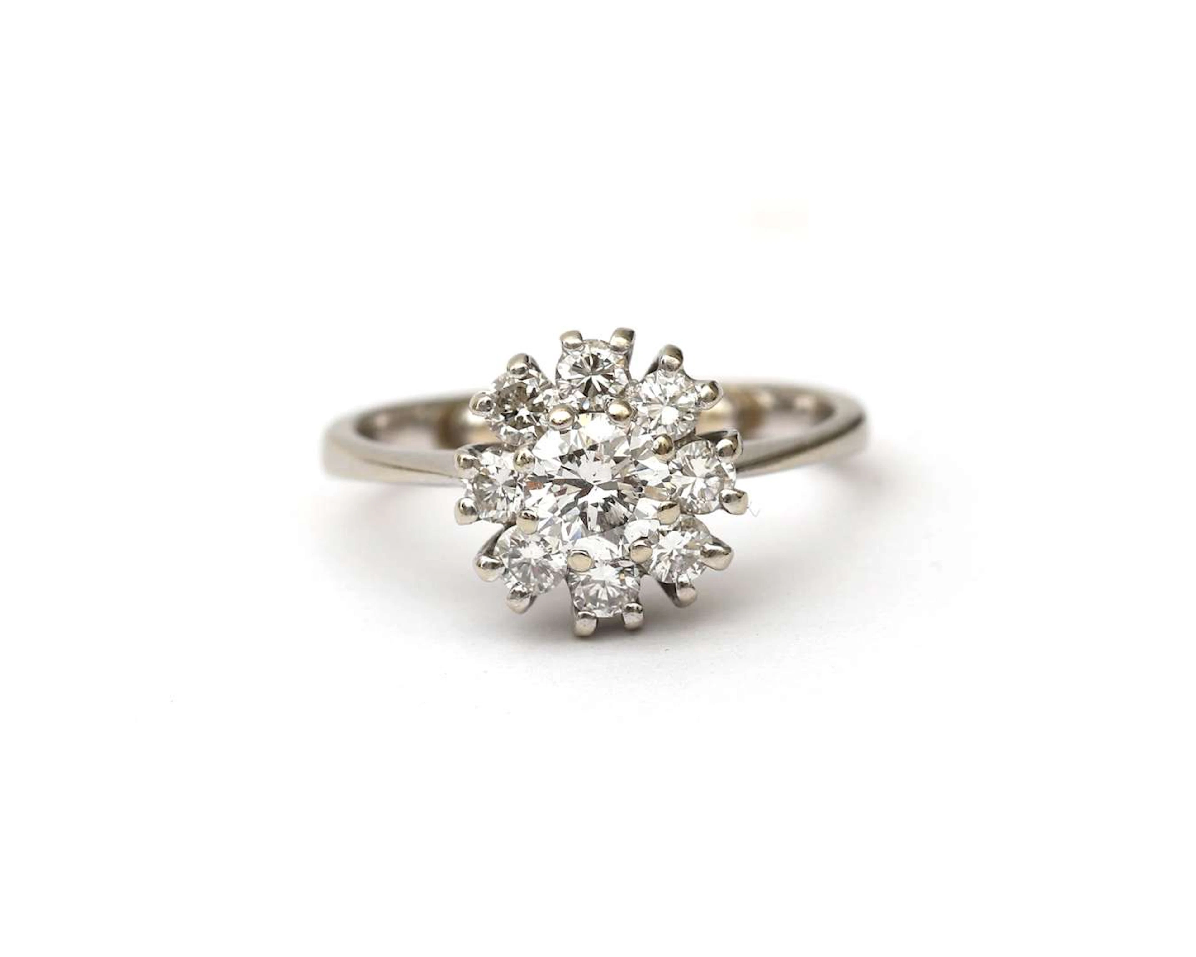 A white gold rosette ring set with a diamond